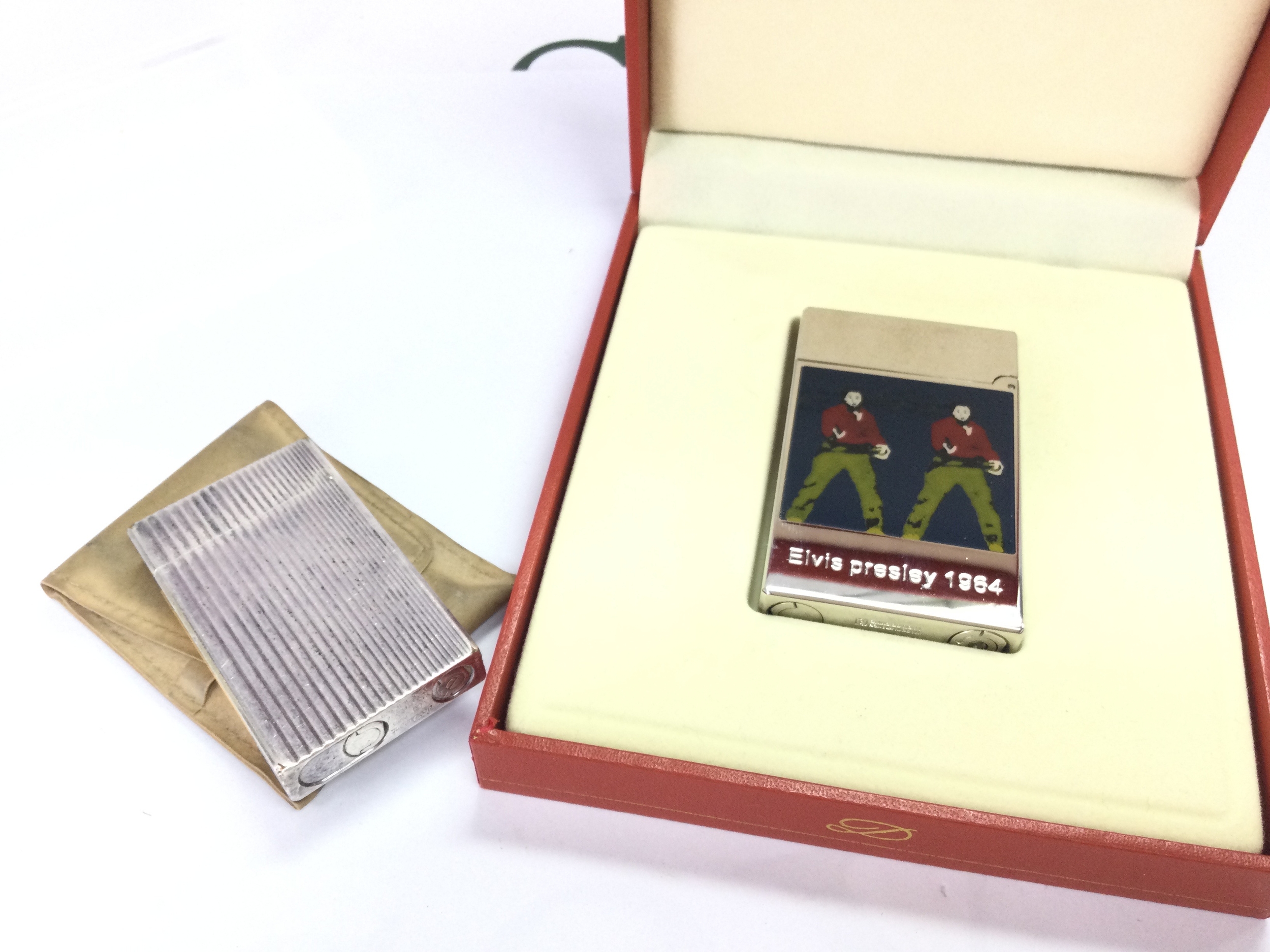 A cased DuPont Elvis Presley 1964 Andy Warhol lighter and another Dupont lighter