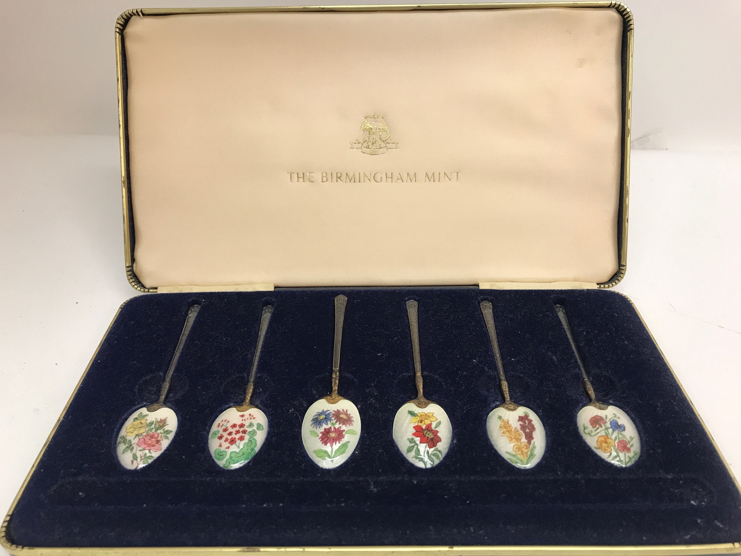 A cased set of silver and enamel spoons, 76g total weight