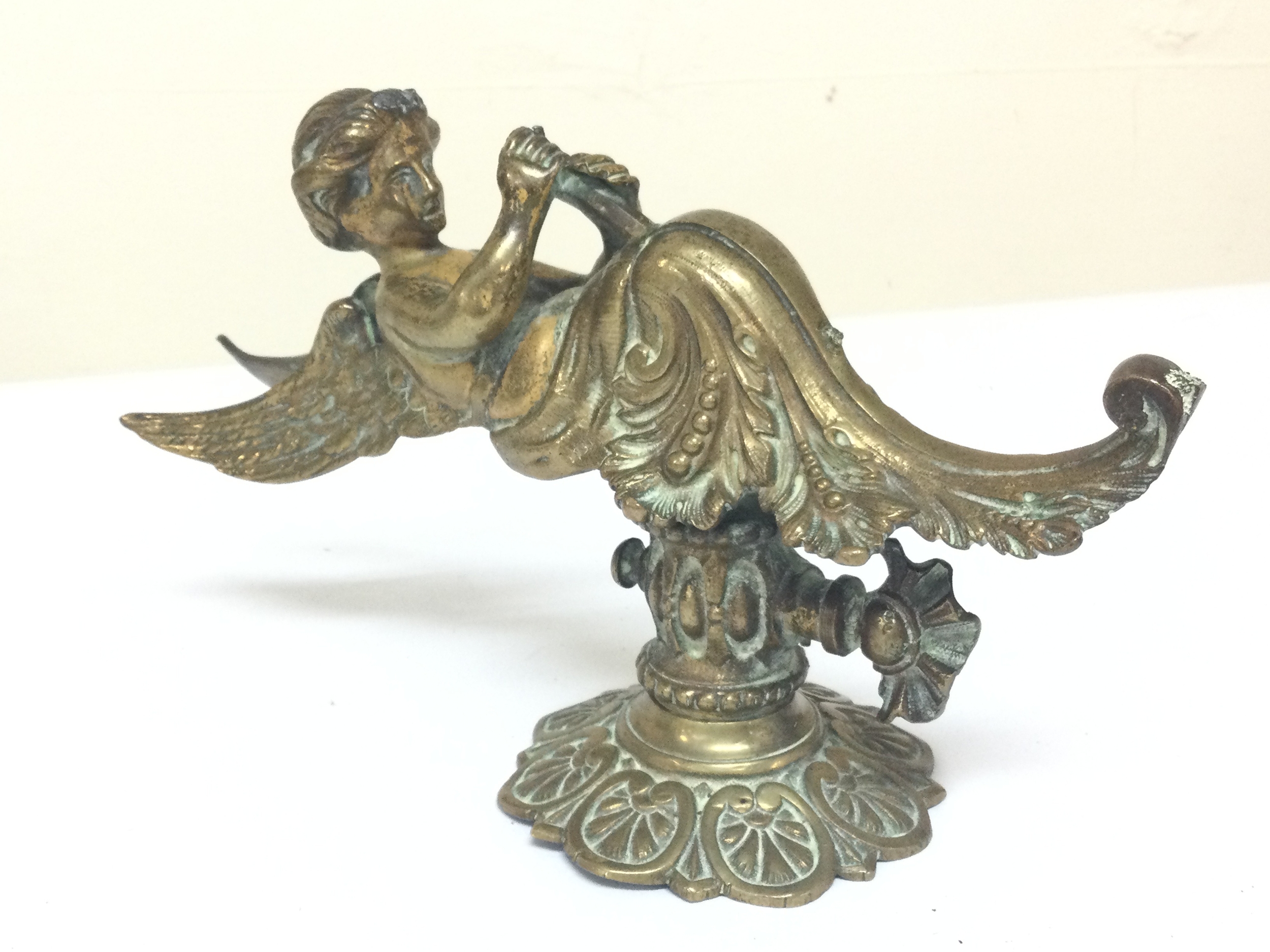 A bronze Victorian water feature with a angelic figure and patterned details. 23cm tall