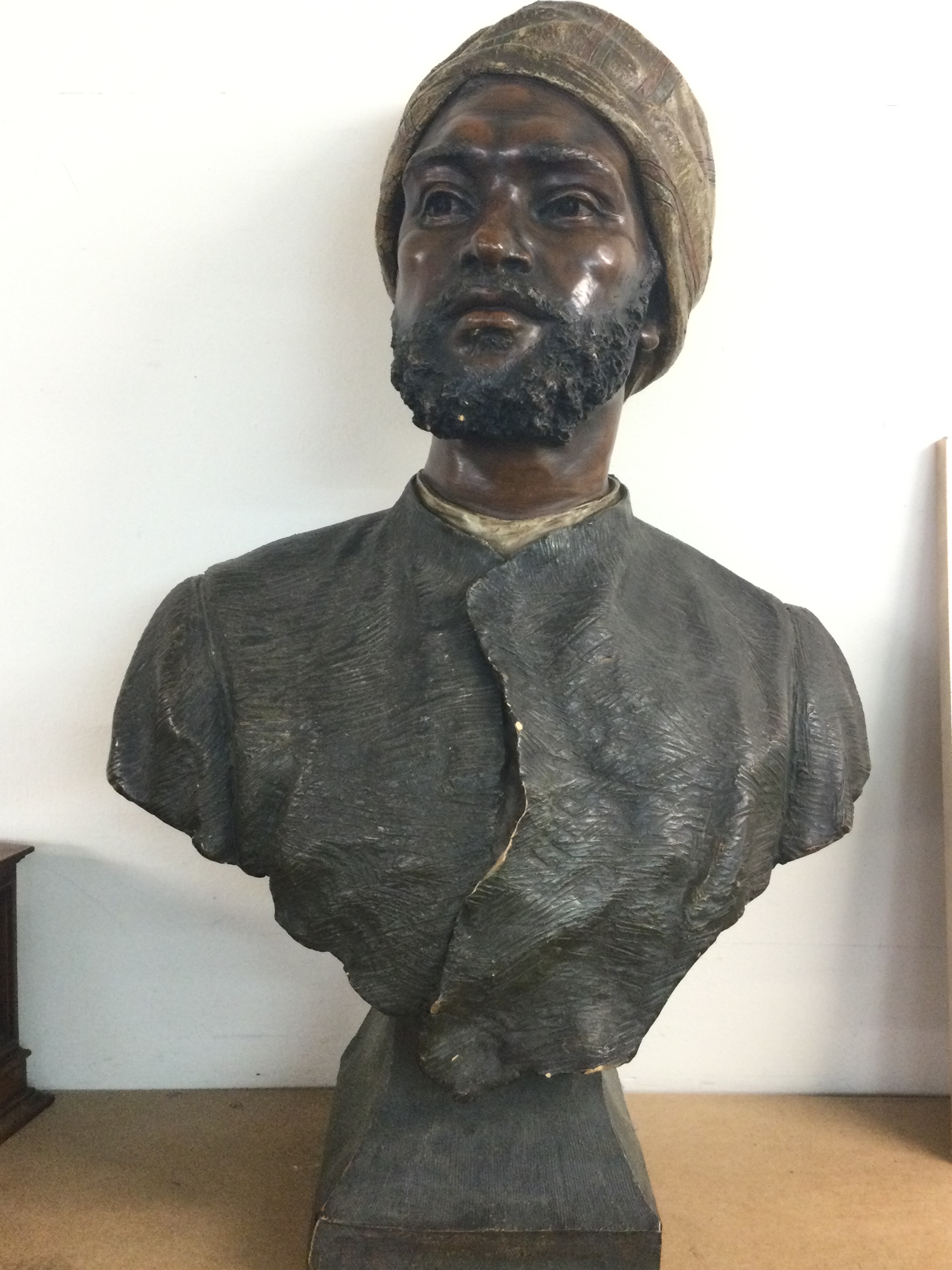 A reproduction bust after GOLDSCHEIDER Friedrich (1845–1897) "Bust of a Man in a Turban" 60cm tall