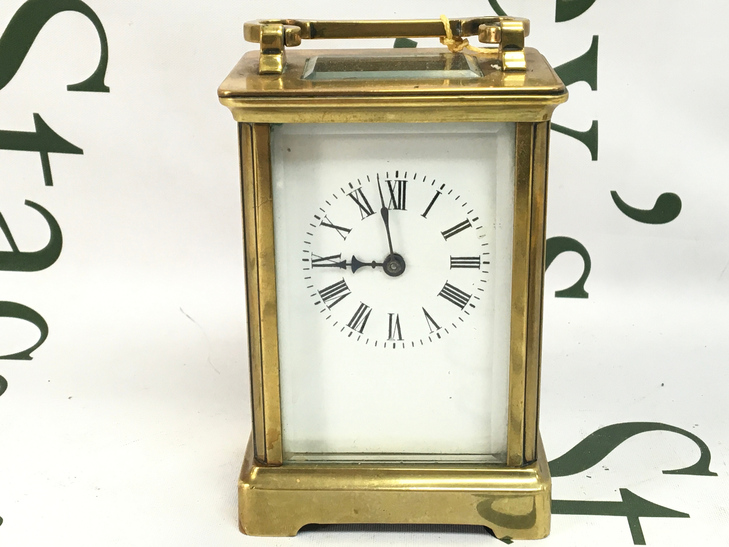 A small vintage carriage clock ,working order. 12cm tall 8cm wide, 6cm Log 