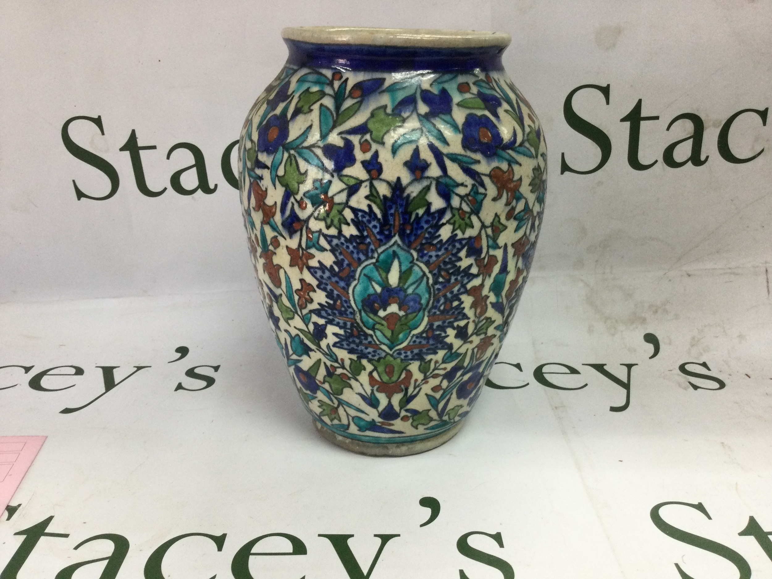 19th C Iznik vase and plate vase brightly coloured with floral motifs, plate in floral symmetrical pattern with restoration. Vase 23cm. Plate 25cm