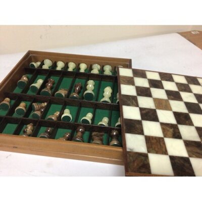 An onyx chess set with matching Onyx pieces.
