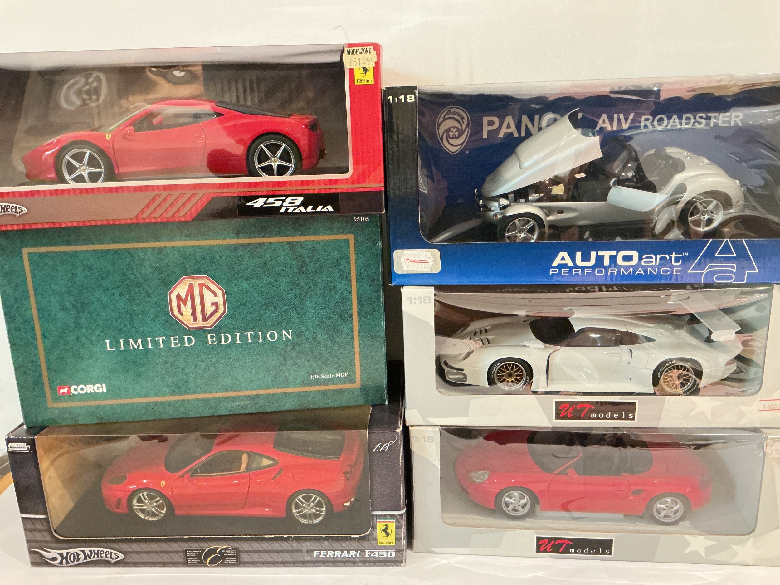 A Collection Of Boxed 1/18 Scale Diecast Including Auto Art, Hot Wheels, UT Models, Corgi And Burago, Also Includes A Corgi Eurofighter.(2).