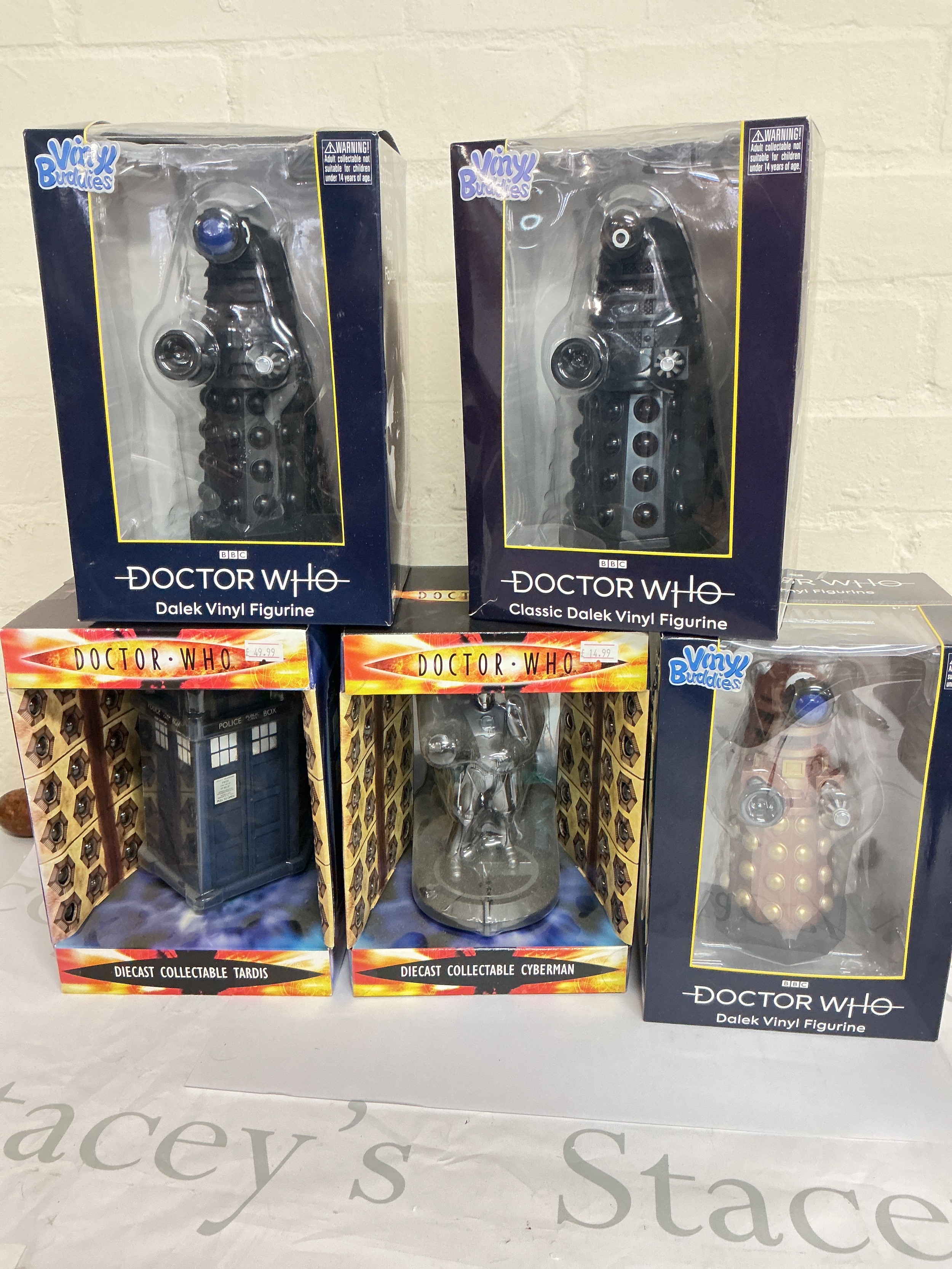 A Collection Of Boxed Doctor Who Models, Including Diecast Collectables, And Vinyl Buddies.
