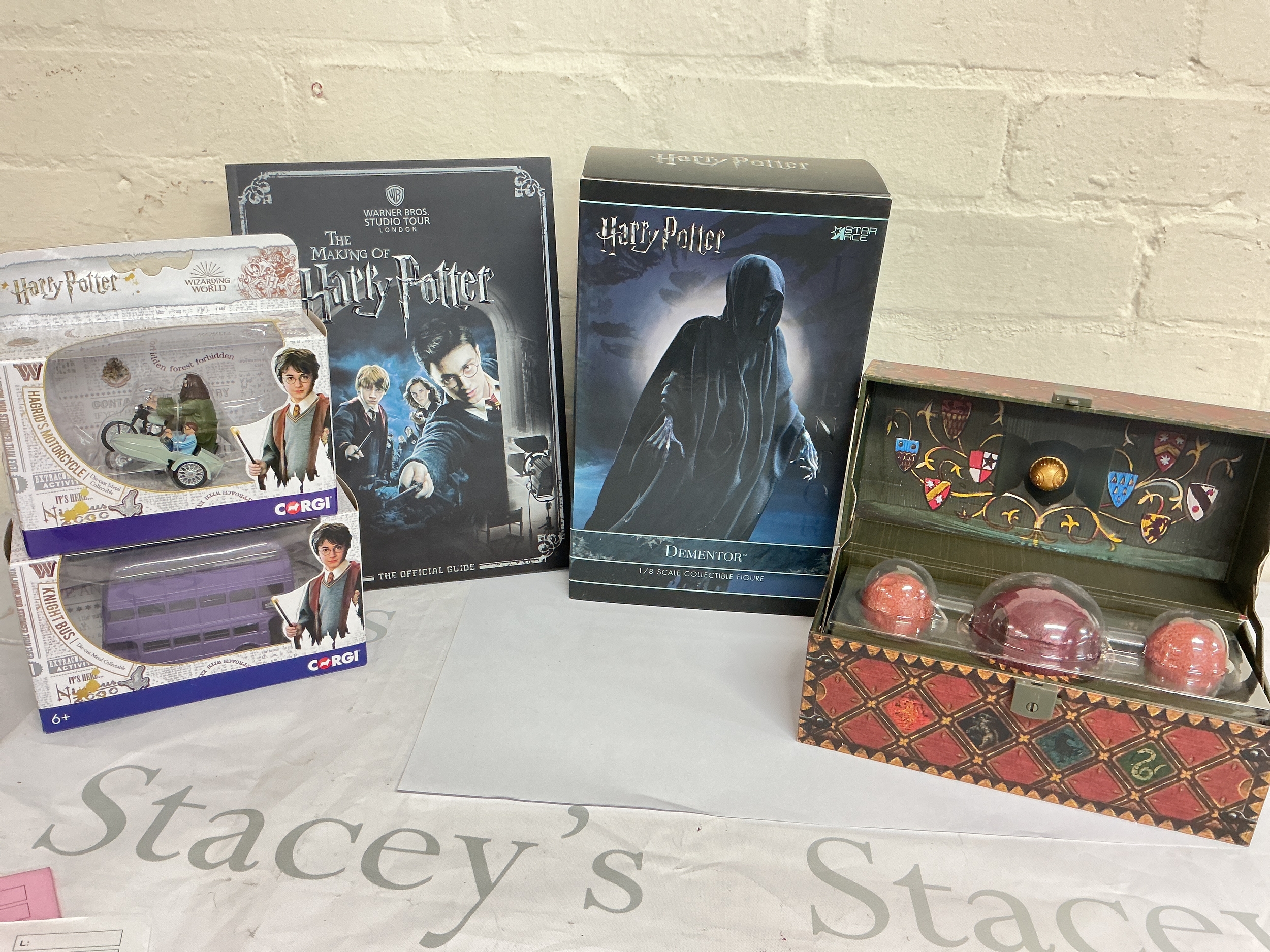 A Collection Of Harry Potter Toys Including Corgi And Magical Creatures.