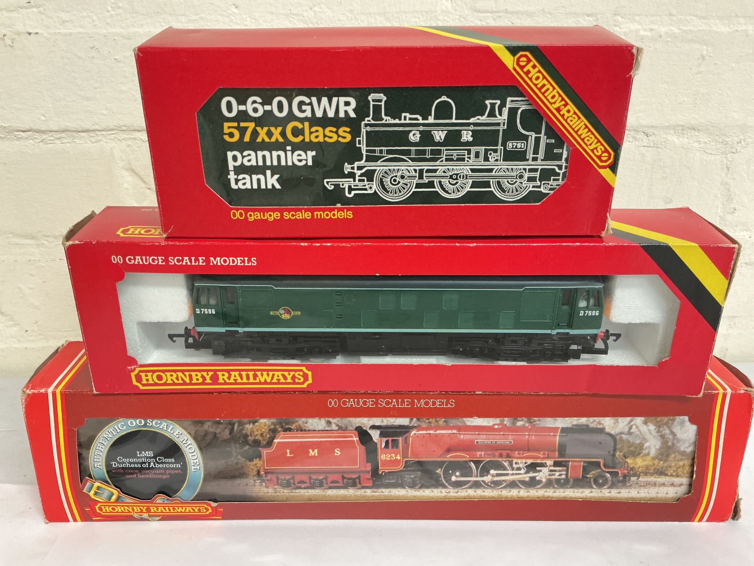3 Boxed Hornby 00 Gauge Locomotives. A 0-6-0 GWR 57xx Class Pannier Tank #R041, A B.R. Class 25 Diesel-Green #R072 And A LMS Coronation Class Duchess Of Abercorn #R305. No Reserve.
