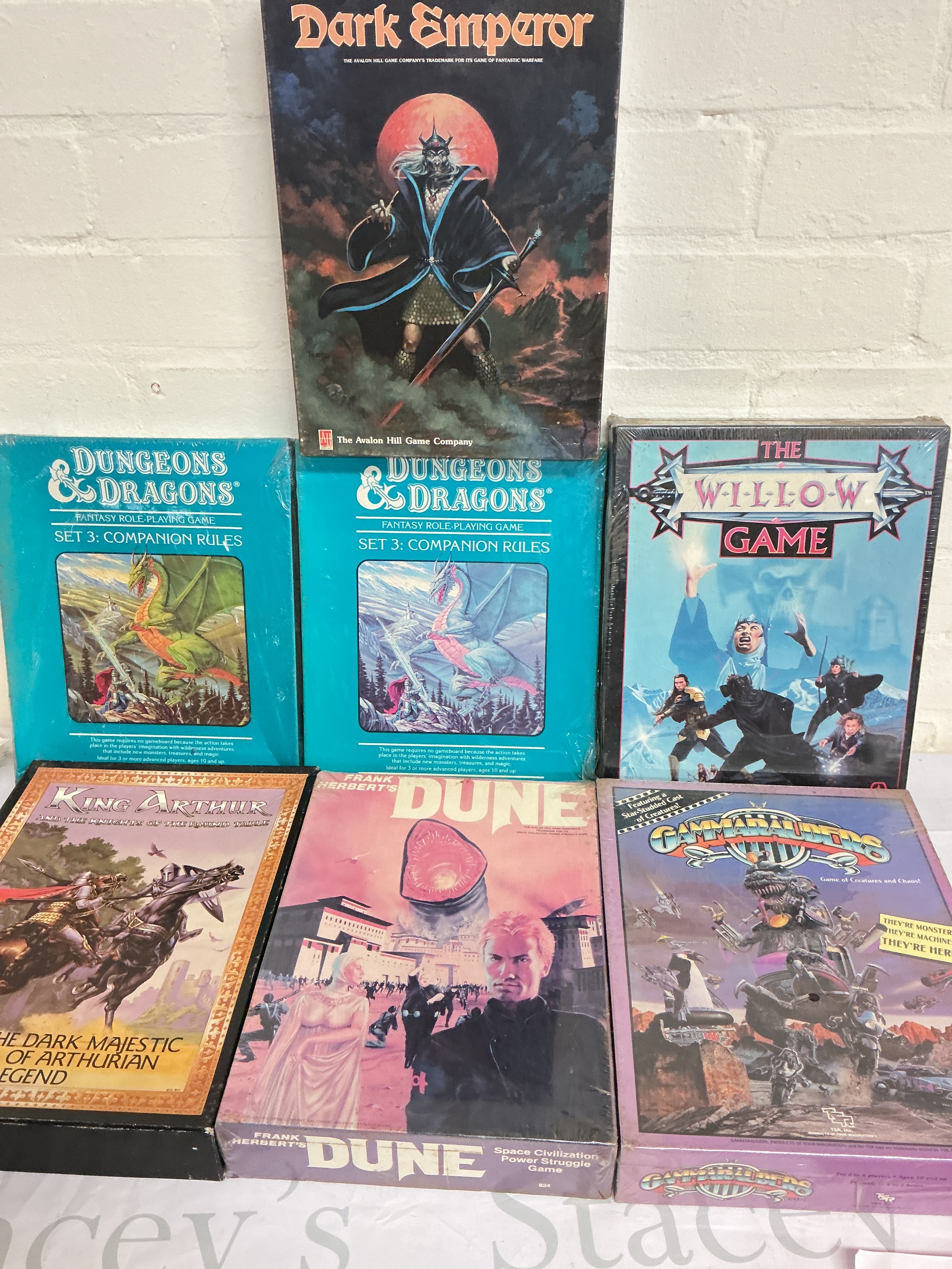 A Collection Of Dungeons And Dragons And Other Board Games And Books.