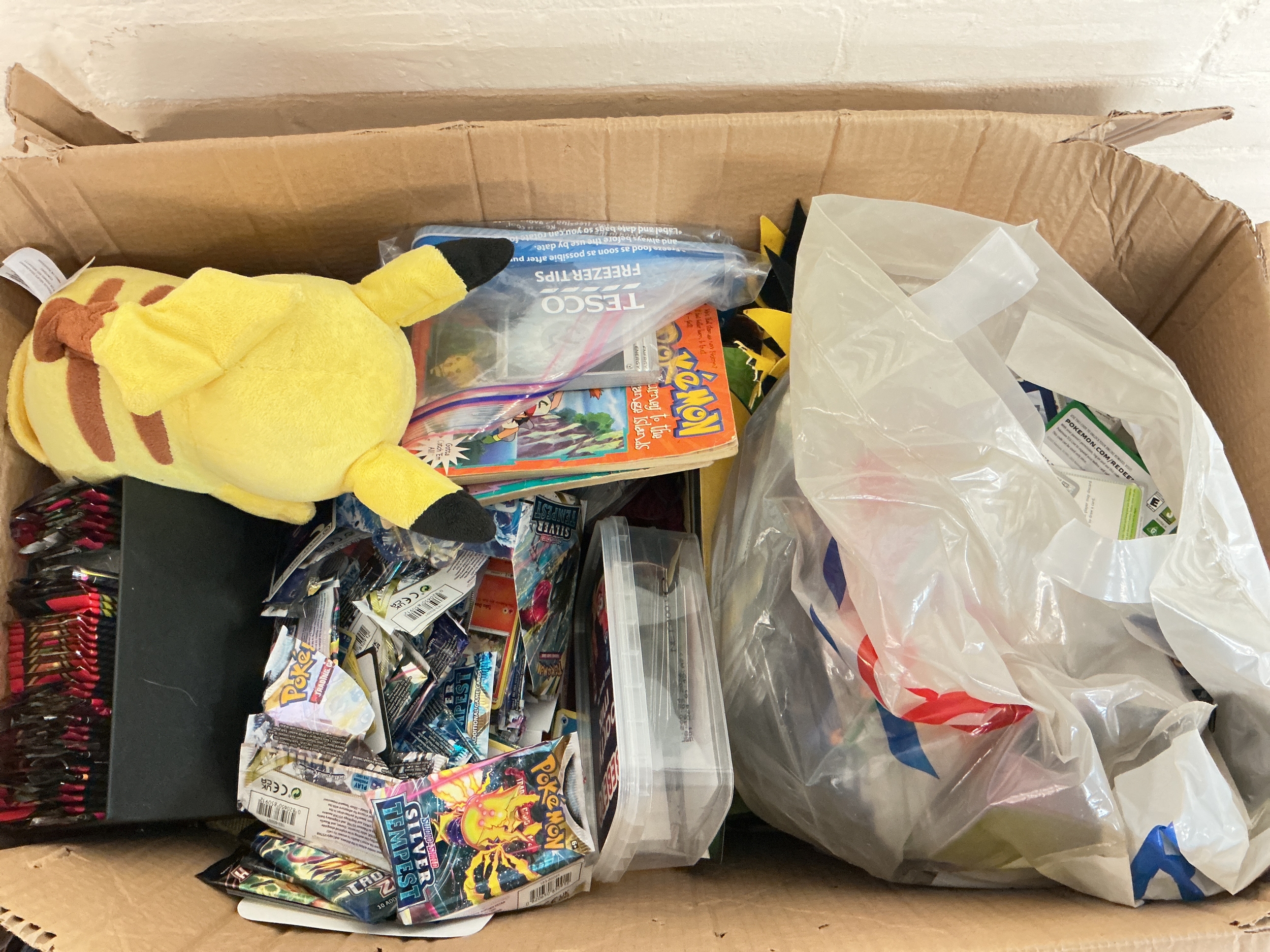 A Collection Of Modern Pokemon Cards And Toys.