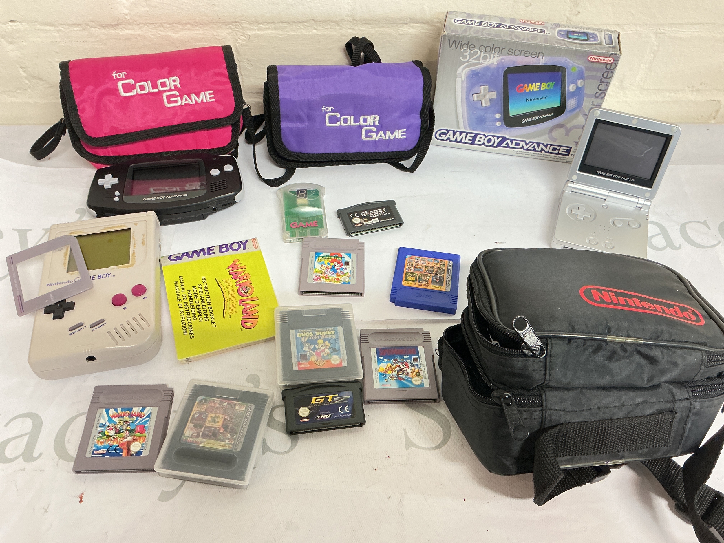 A Collection Of 4 Nintendo Game Boys Including A Boxed Advance, Also Includes Games. No Reserve.