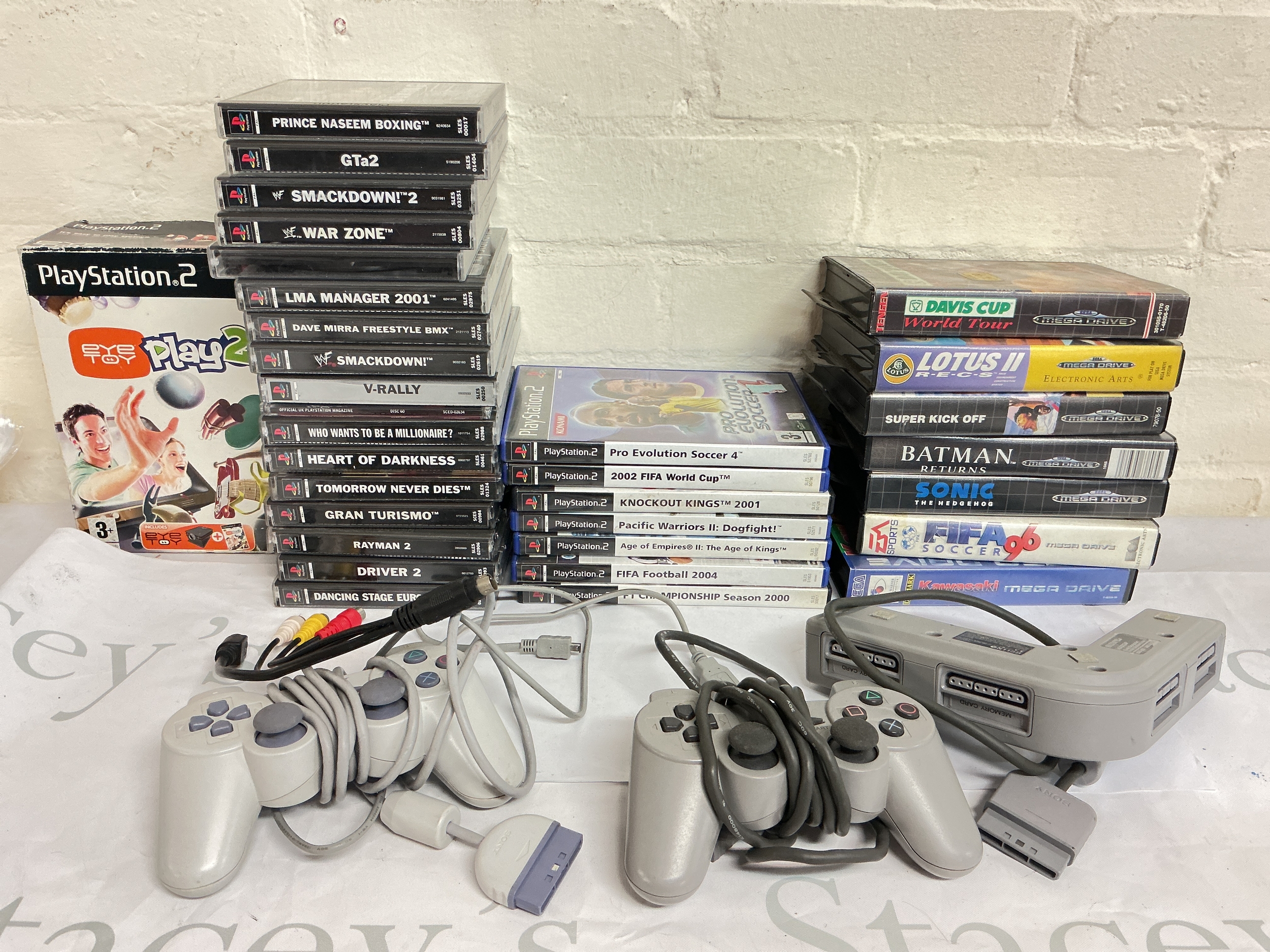 A Collection Of PlayStation 1And 2 Games And Sega Mega Drive. No Reserve.