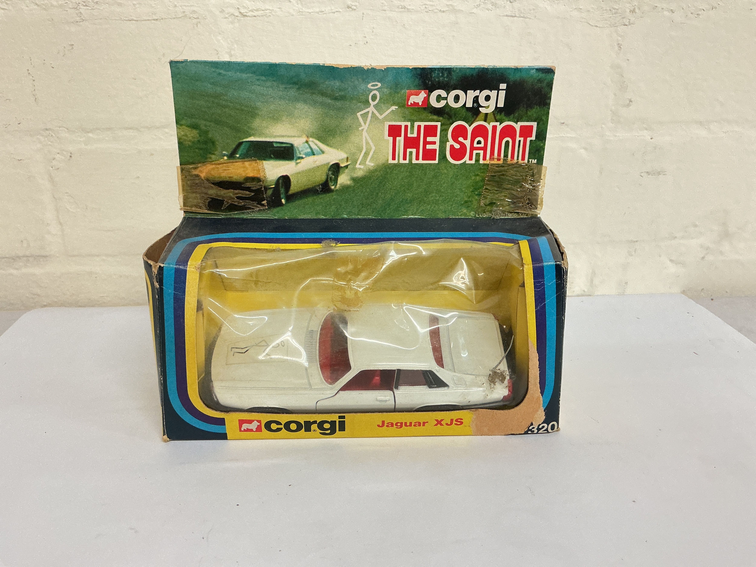 A Boxed Corgi The Saint Jaguar XJS #320. Box Is Worn, No Reserve.