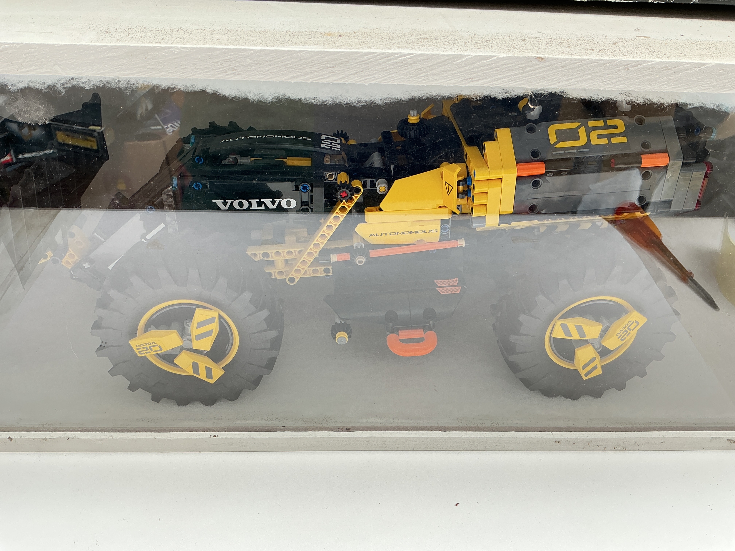 A Lego Volvo Concept Wheel Loader Zeus In Display Case With Box And Manual. #42081. No Reserve.