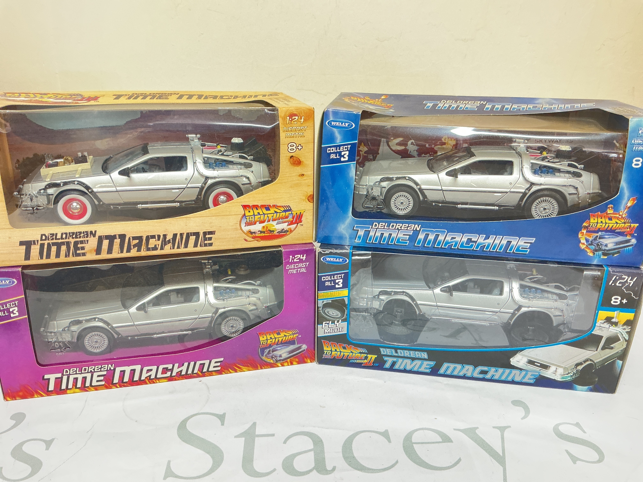4 X Boxed Welly 1/24 Scale Back ToThe Future Deloreans. No Reserve.