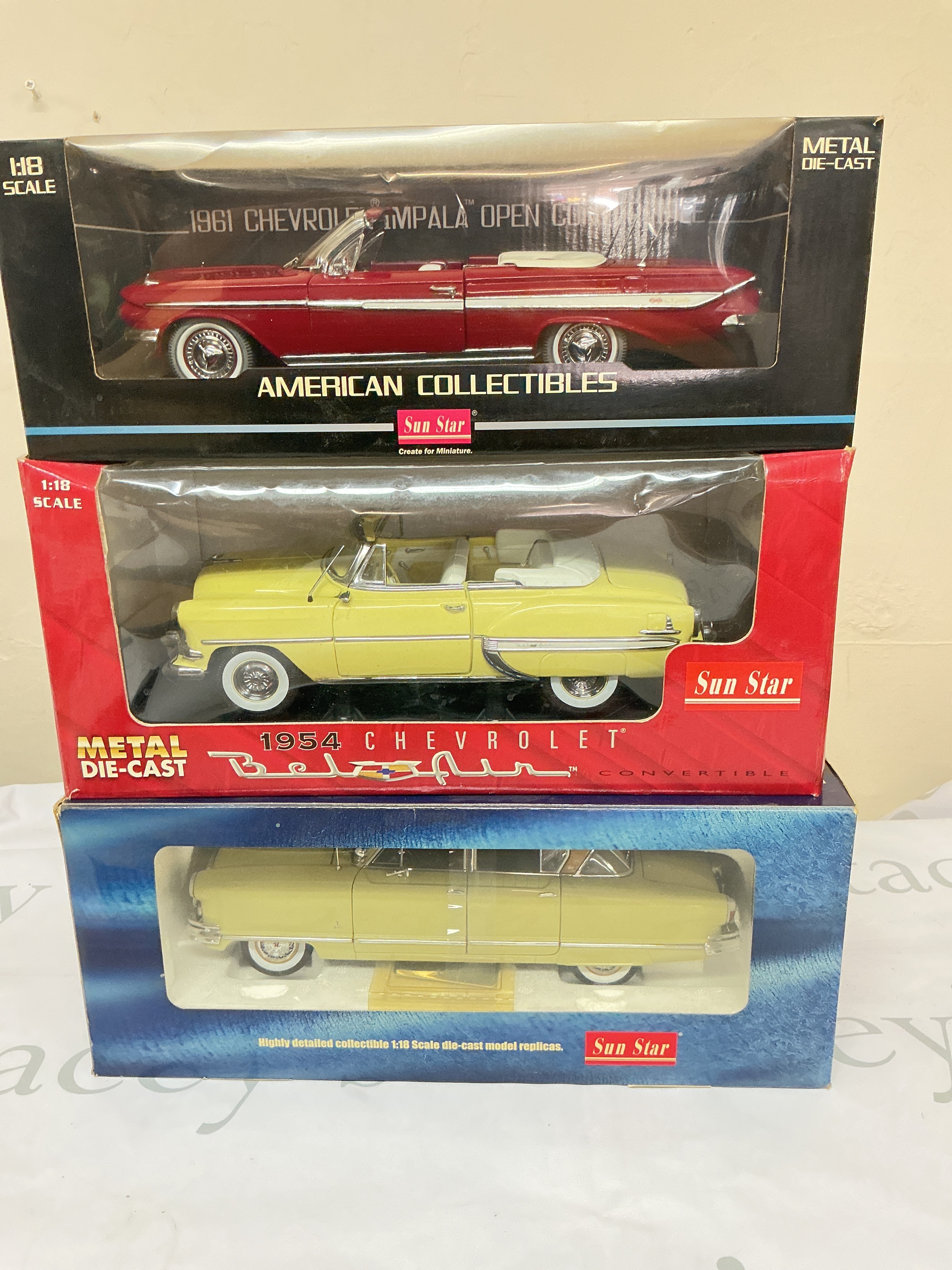 3 Boxed Sun Star Diecast Vehicles, A 1961 Chevrolet Impala Open Convertible,A 1934 Chevrolet Bel Air Open Convertible And A 1952 Nash Ambassador Airflyte. All 1/18 Scale. No Reserve. 
