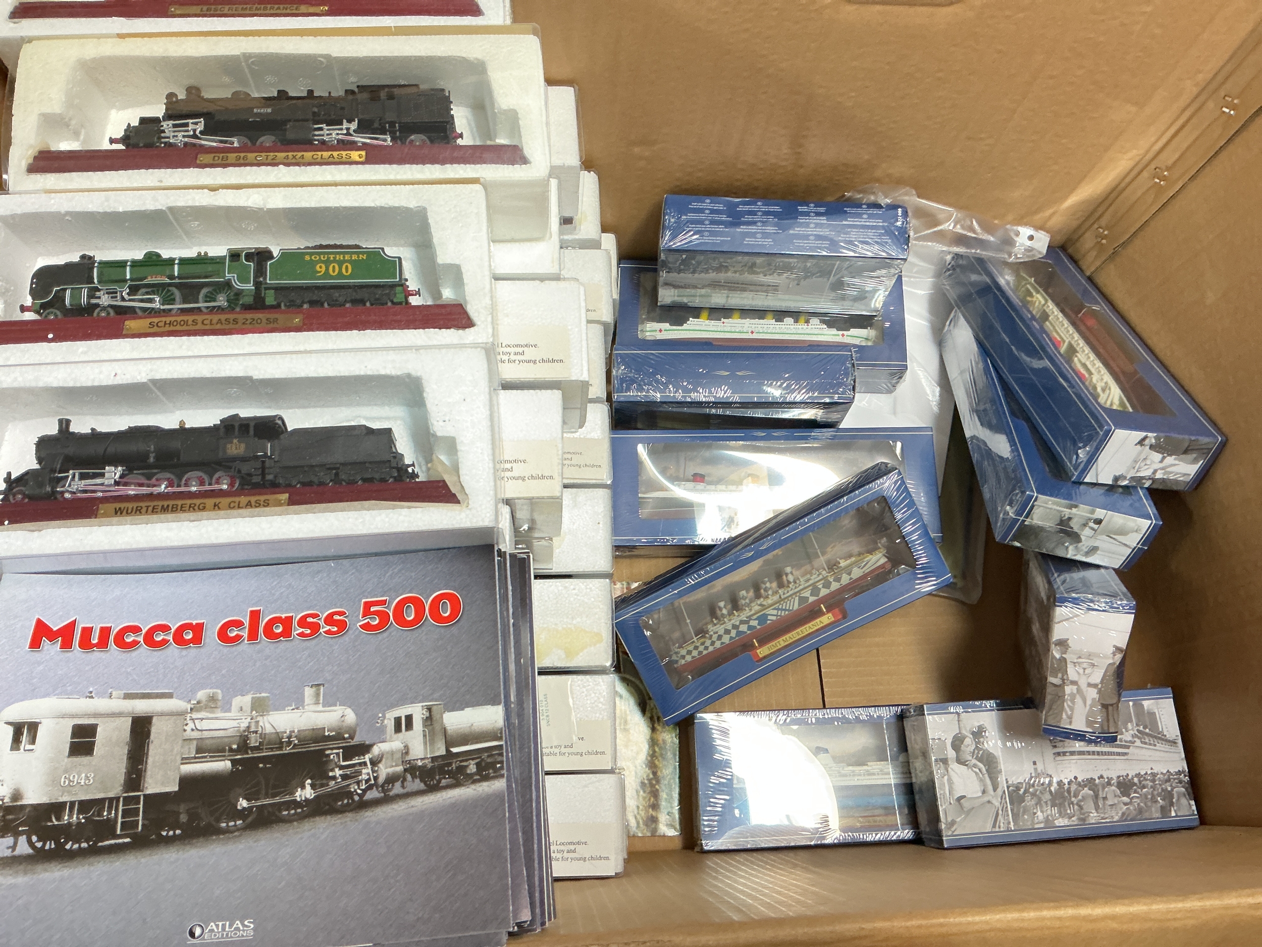 A Box Containing A Collection Of Boxed Atlas Editions Locomotives And Ships. No Reserve.