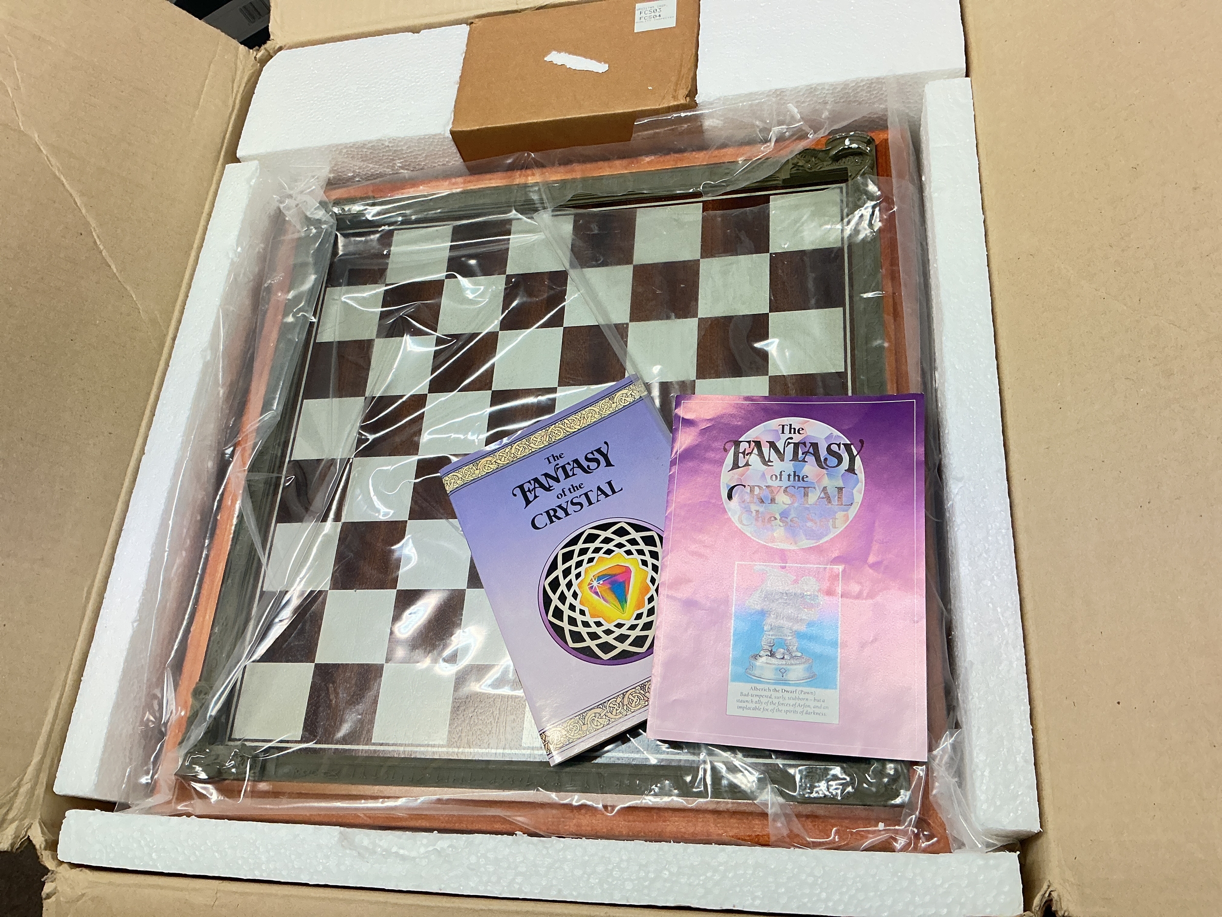 A Danbury Mint The Fantasy Of The Crystal Pewter Chess Set.