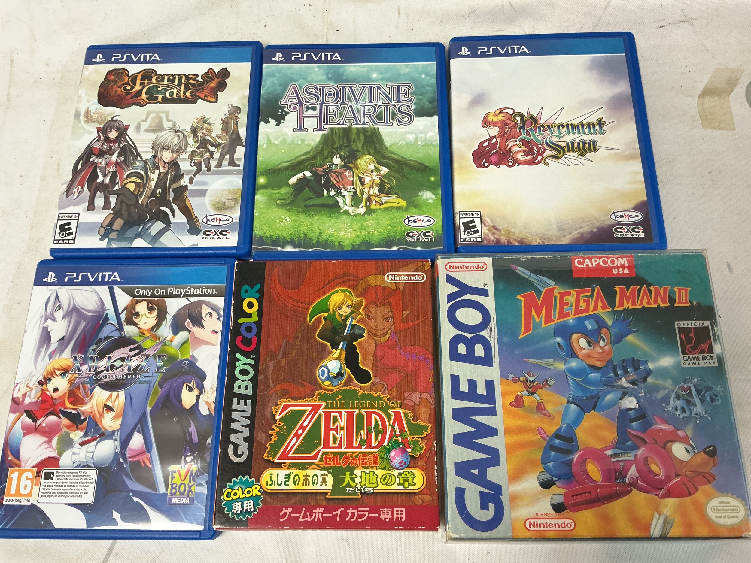 4 PlayStation Vita Games A Game Boy Legends Of Zelda And A Mega Man II. No Reserve.