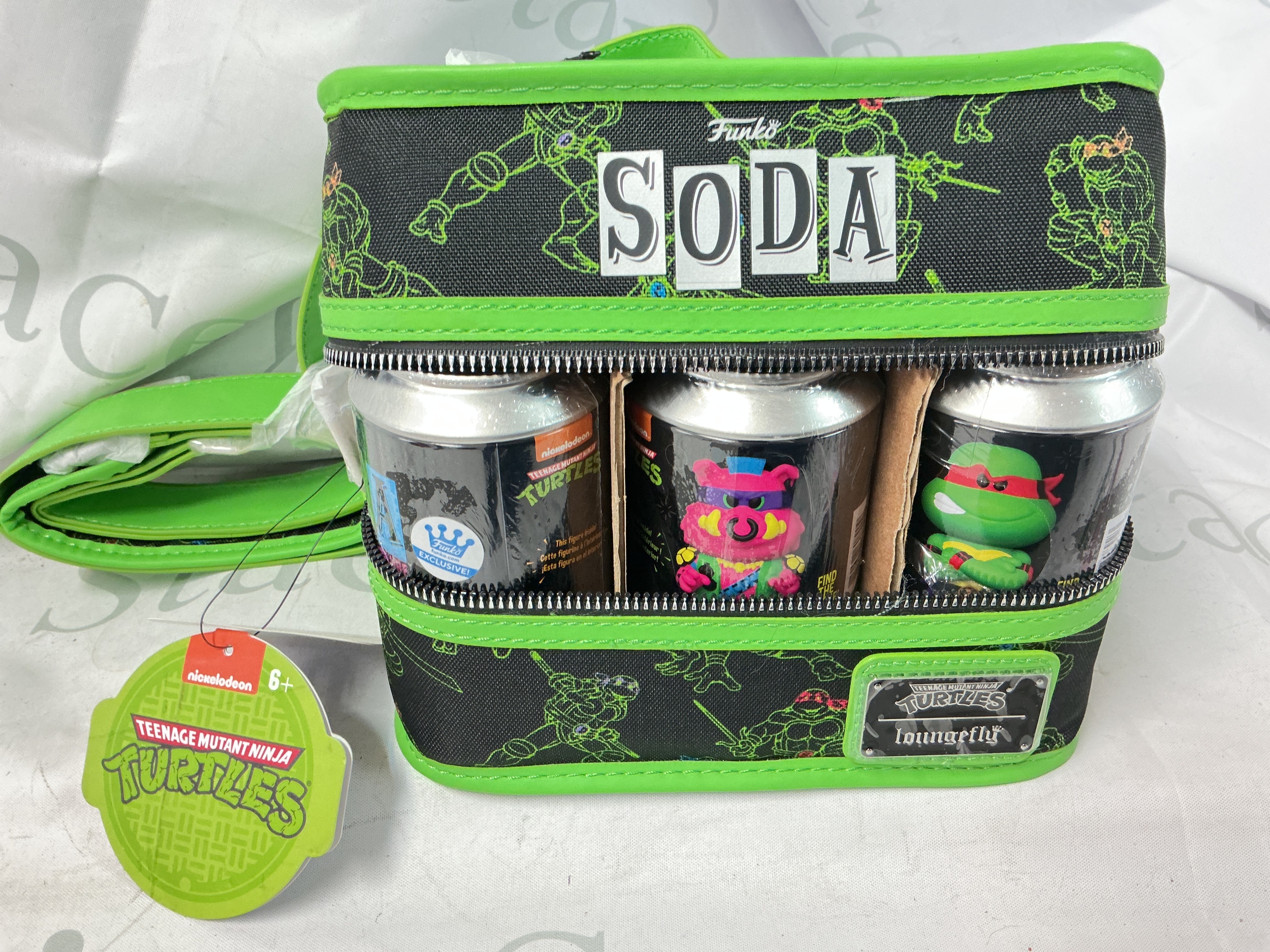 A Funko Vinyl Soda Tenabe Mutant Ninja Turtles Black-Light 6-Pack With Loungefly Cooler Bag. No Reserve.