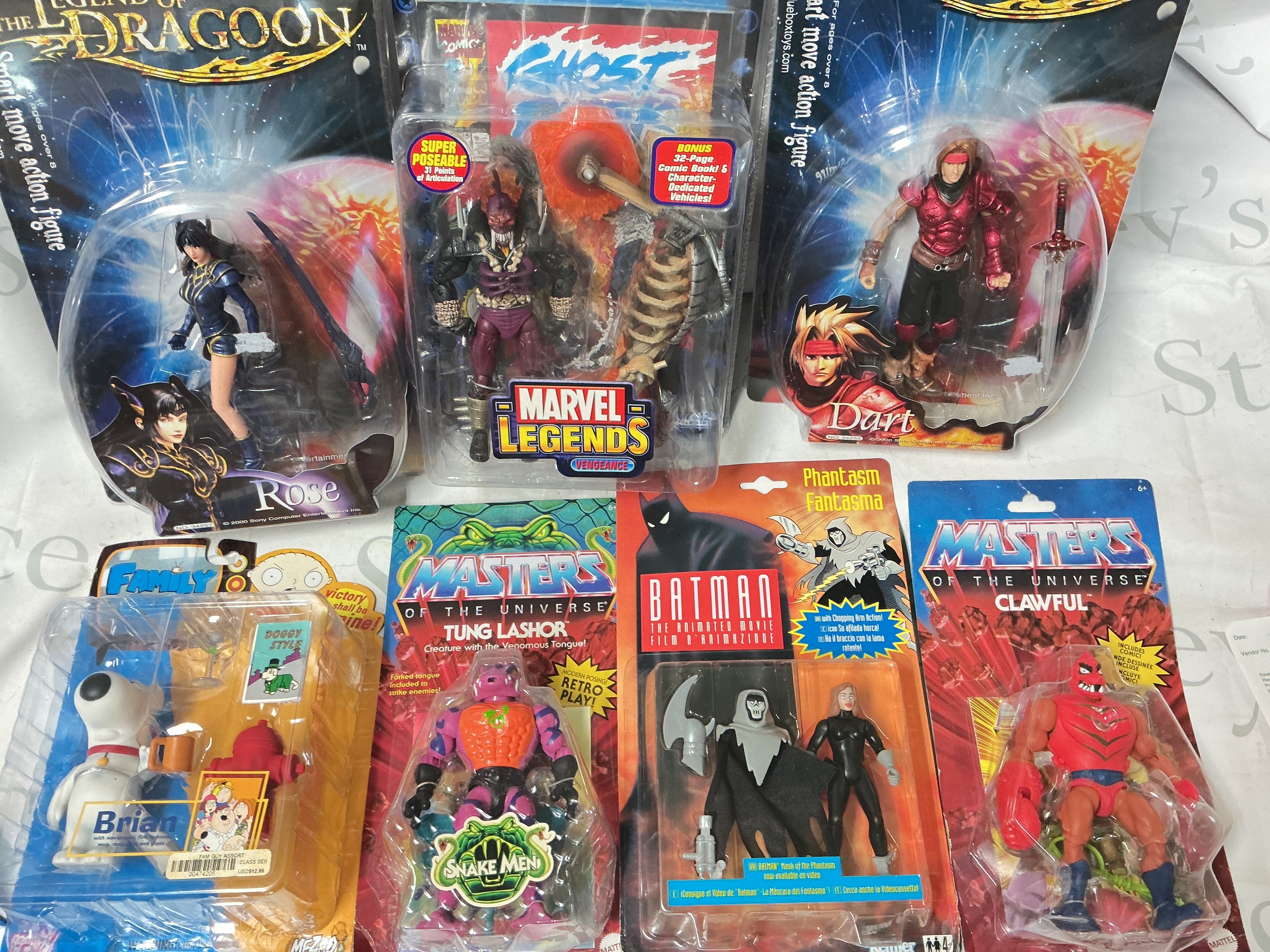 A Collection Of Various Carded Figures Including Masters Of The Universe Origins, Family Guy, Marvel, Star Wars, The Legend Of The Dragoon.