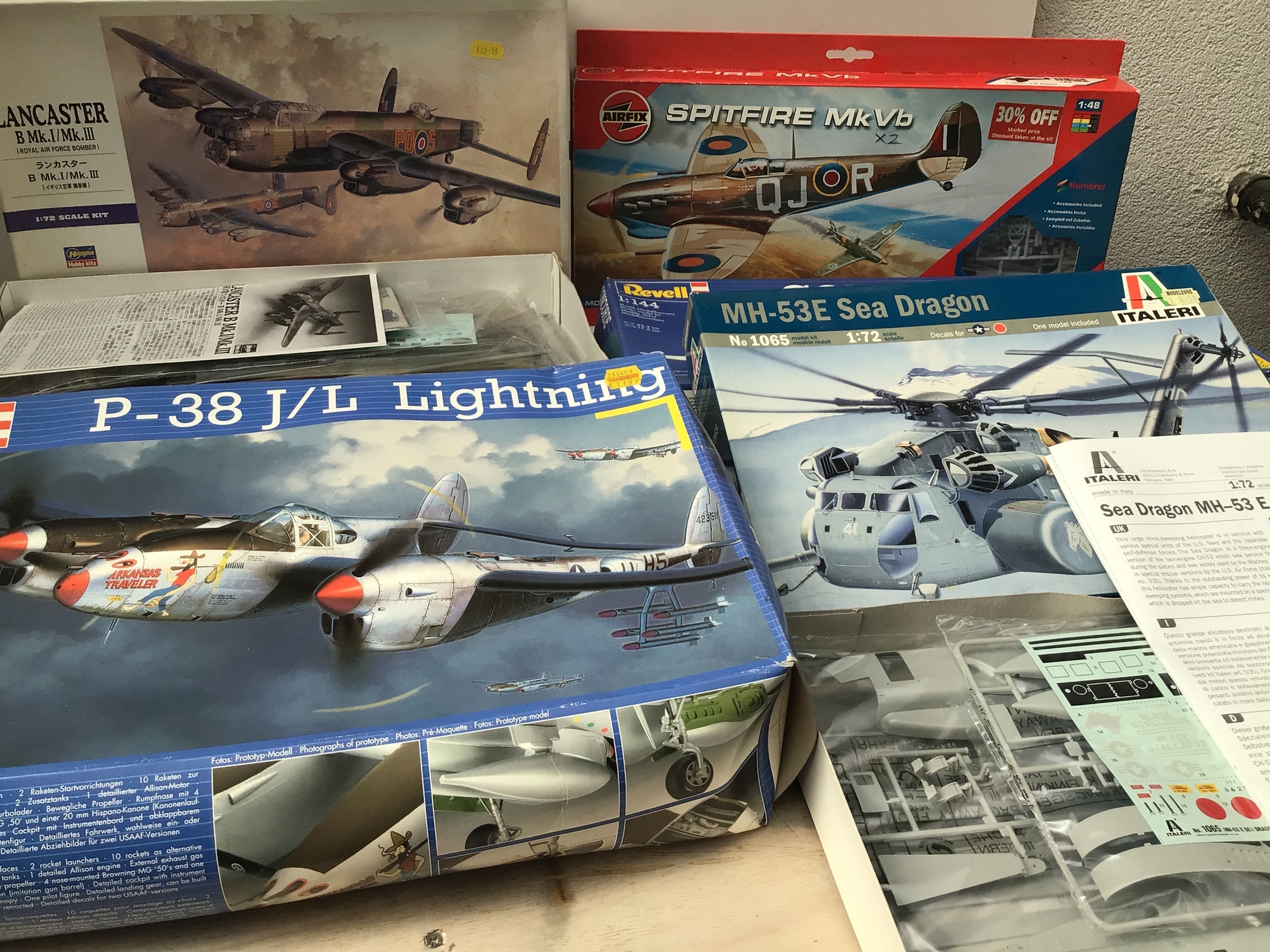 Bag containing boxed model aircraft kits by various manufacturers in numerous scales. Possibly 2 models in spitfire box.  No reserve