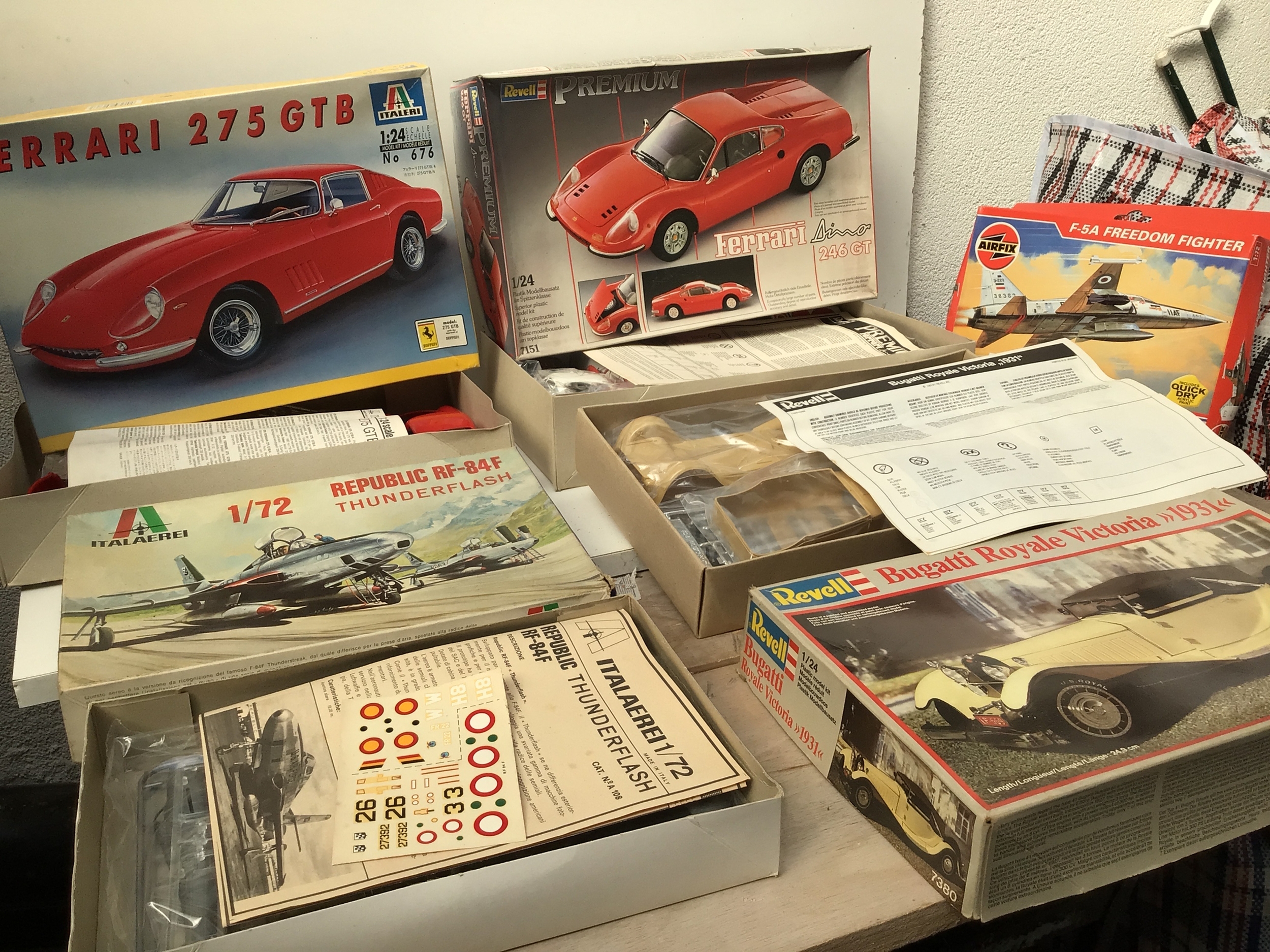 A collection of boxed model kits featuring Cars and aircraft in various scales.  Manufacturers include Revell, Italeri, Airfix etc.  no reserve