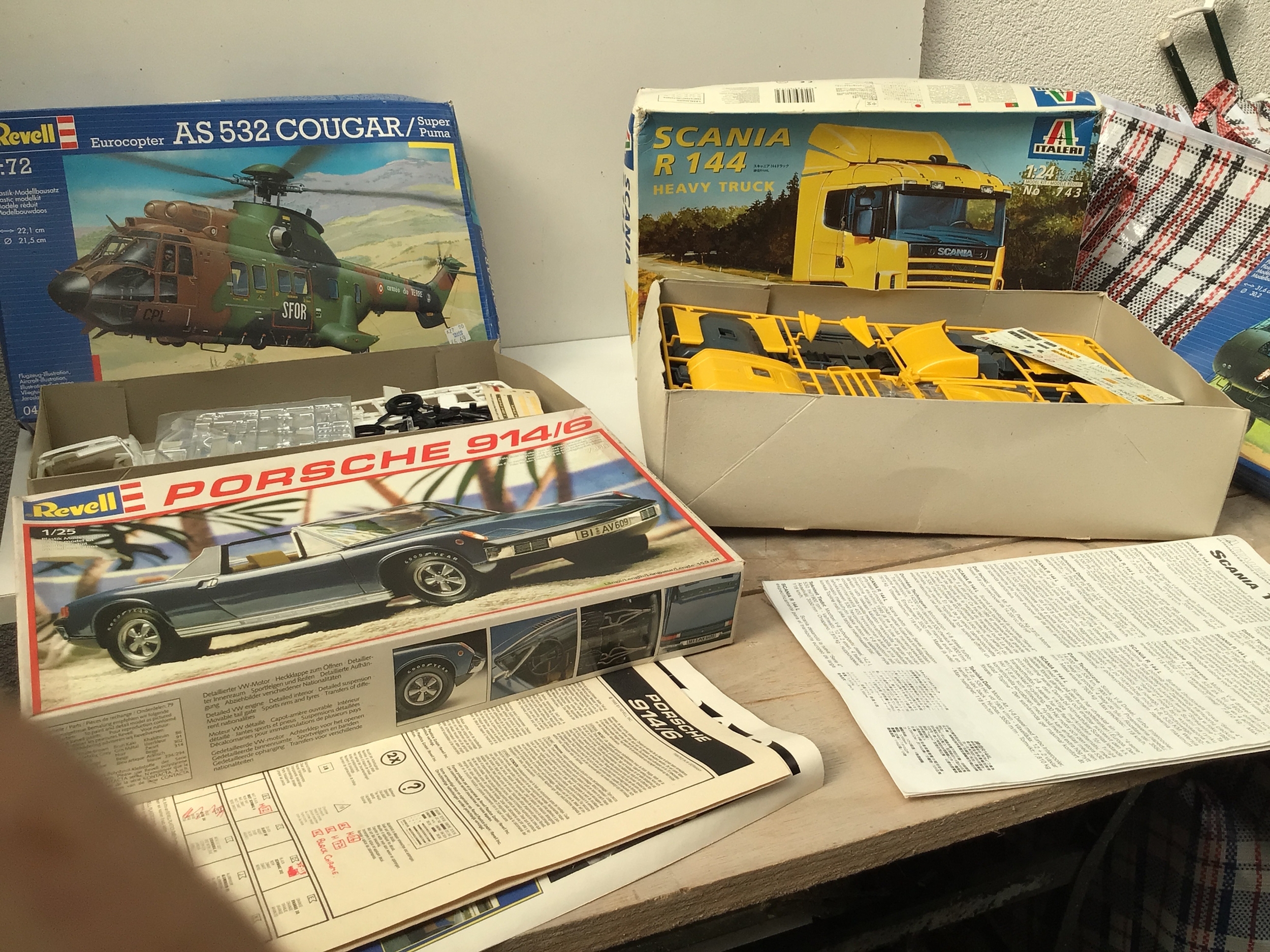 A bag containing a collection of boxed model kits by manufacturers Revell, ,  monogram etc.  featuring Aircraft and Cars in various scales.  No reserve.