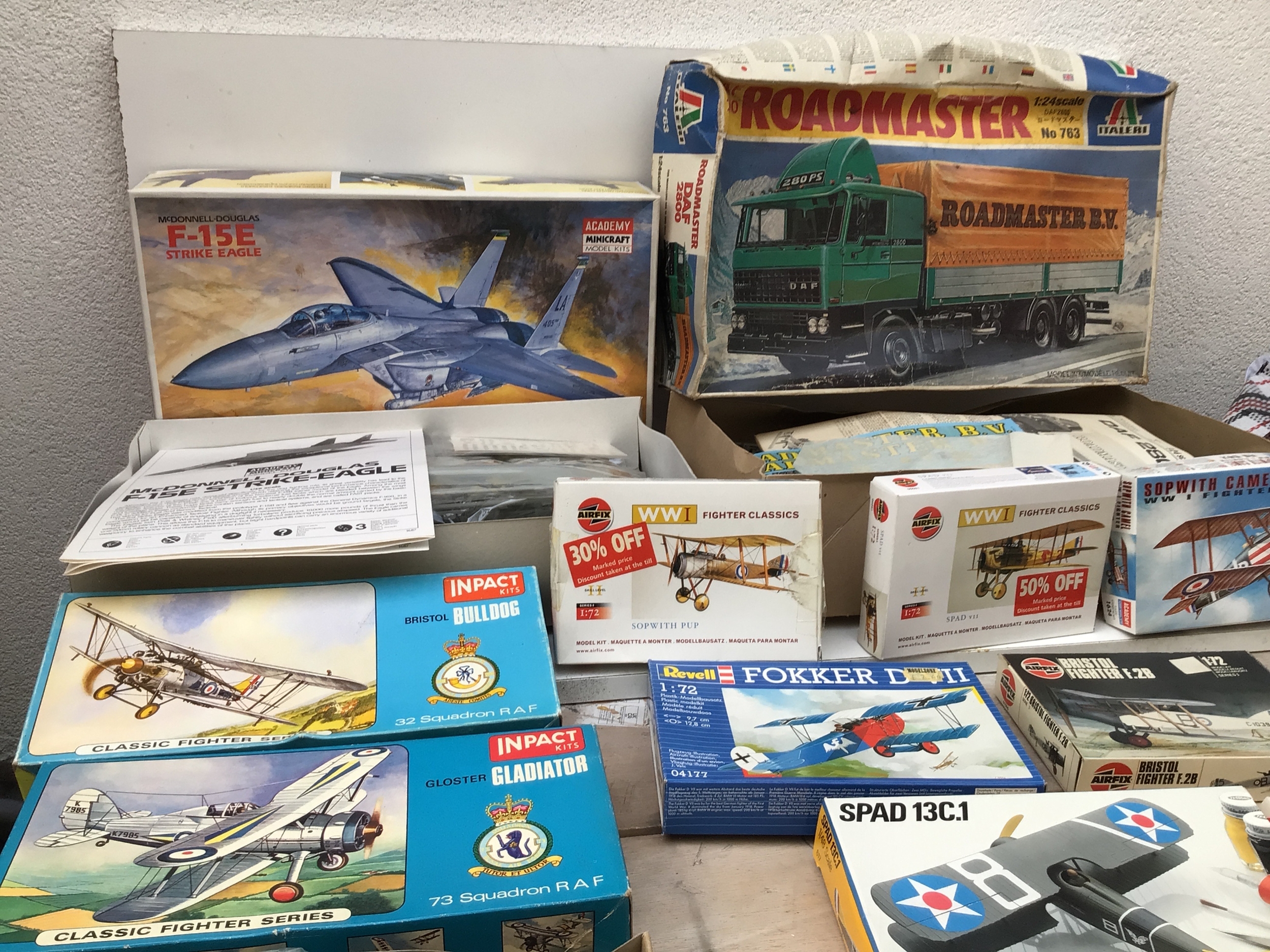 A collection of boxed model kits by Revell, Inpact, Airfix etc in a variety of scales features mainly aircraft with one lorry.  No reserve