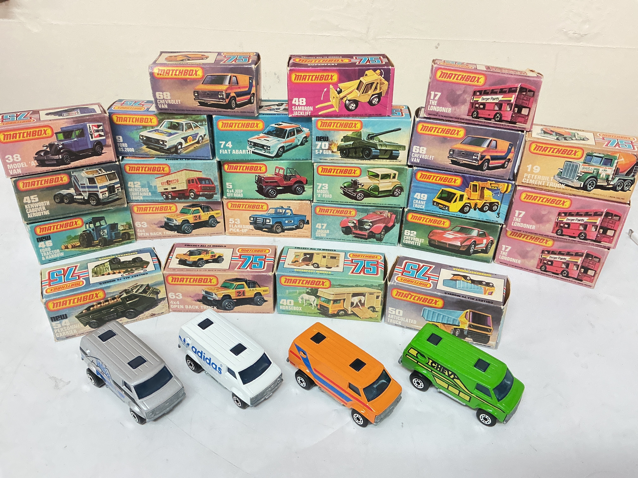A Collection Of 25 Boxed Matchbox Superfast Diecast, plus 4 Extra loose Chevy Vans. No Reserve.