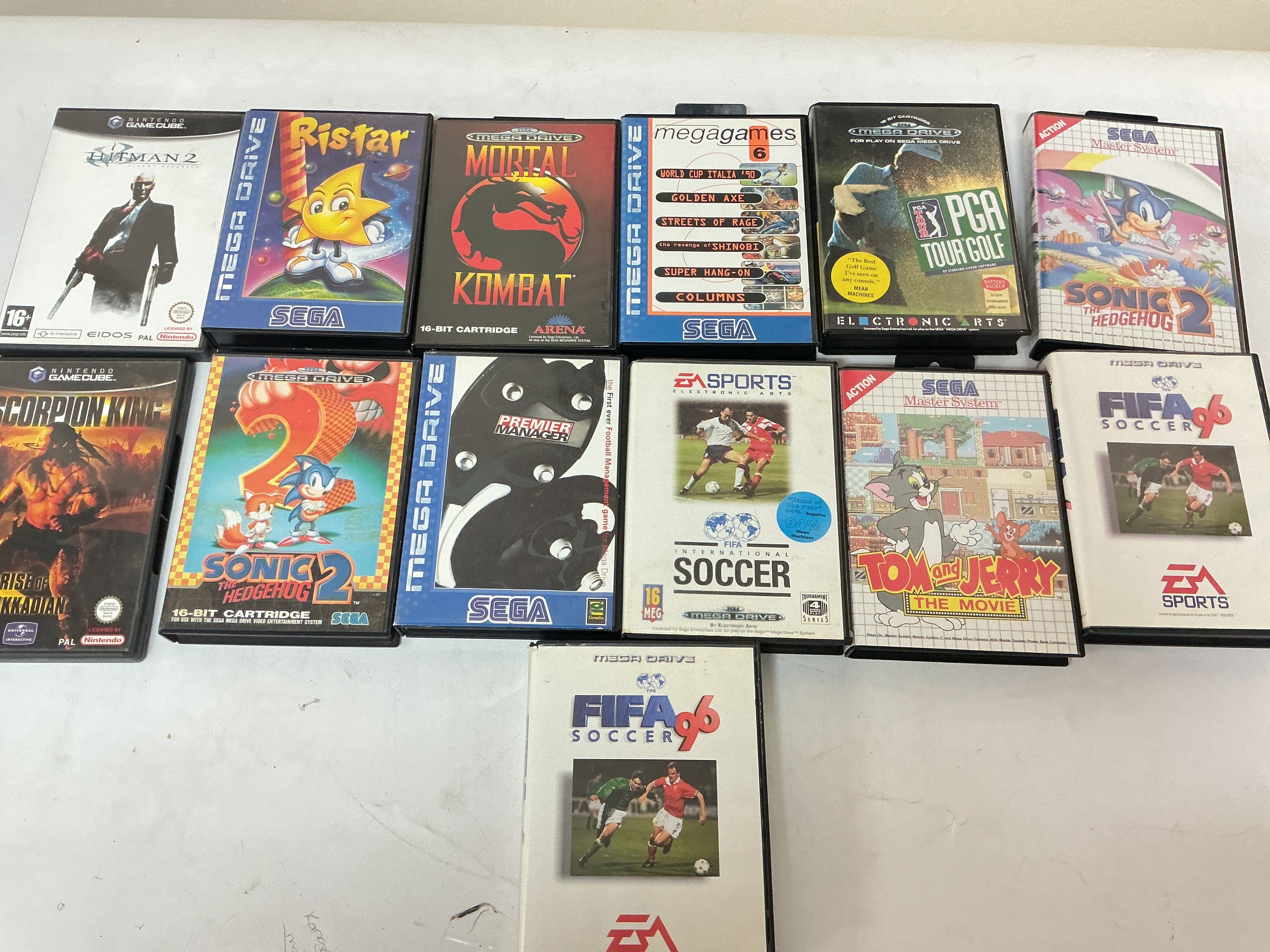A Box Containing Sega Mega Drive, Atari, Game Cube And Dreamcast Games.