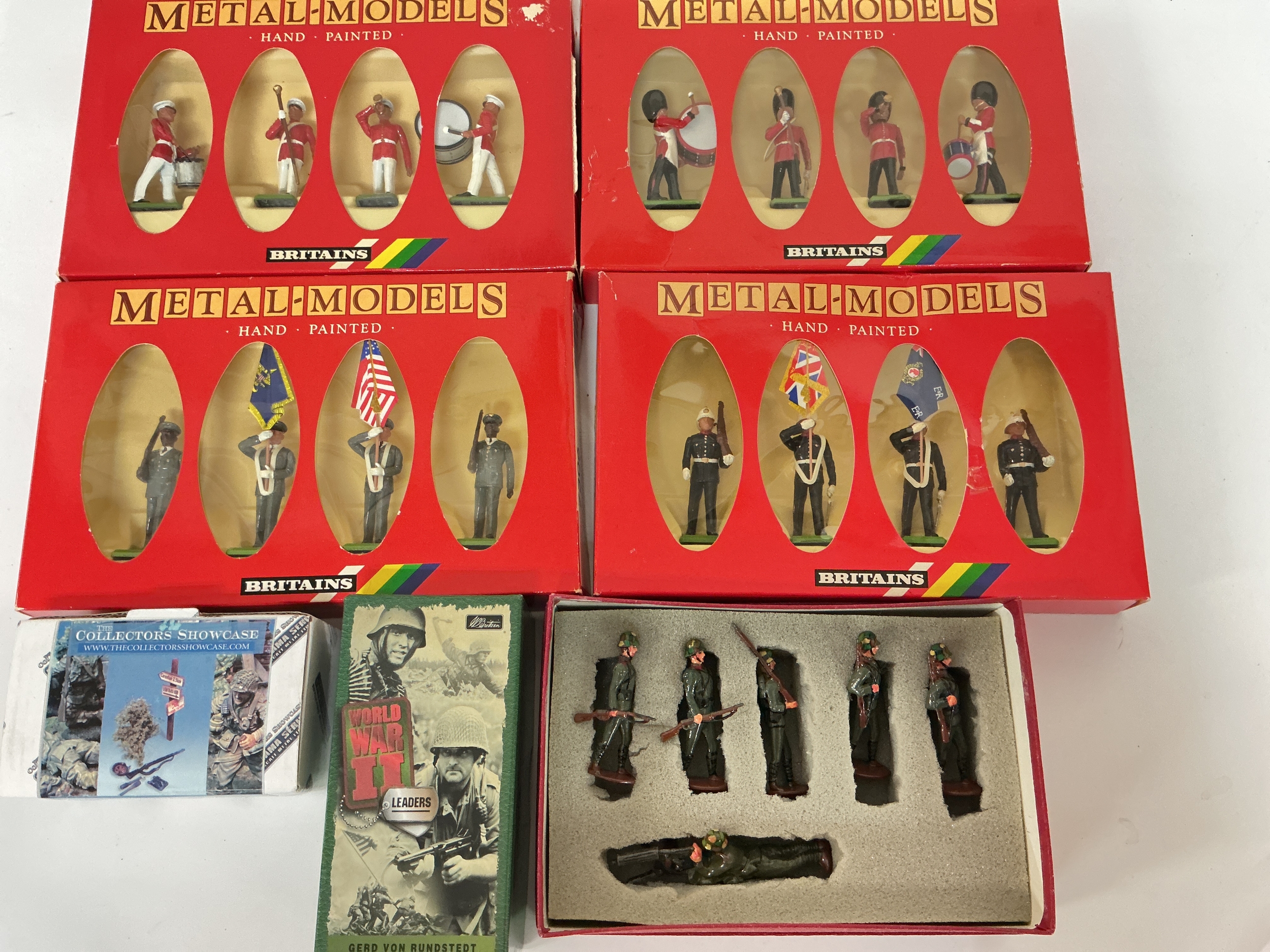 A Collection Of Boxed Britains Soldiers.