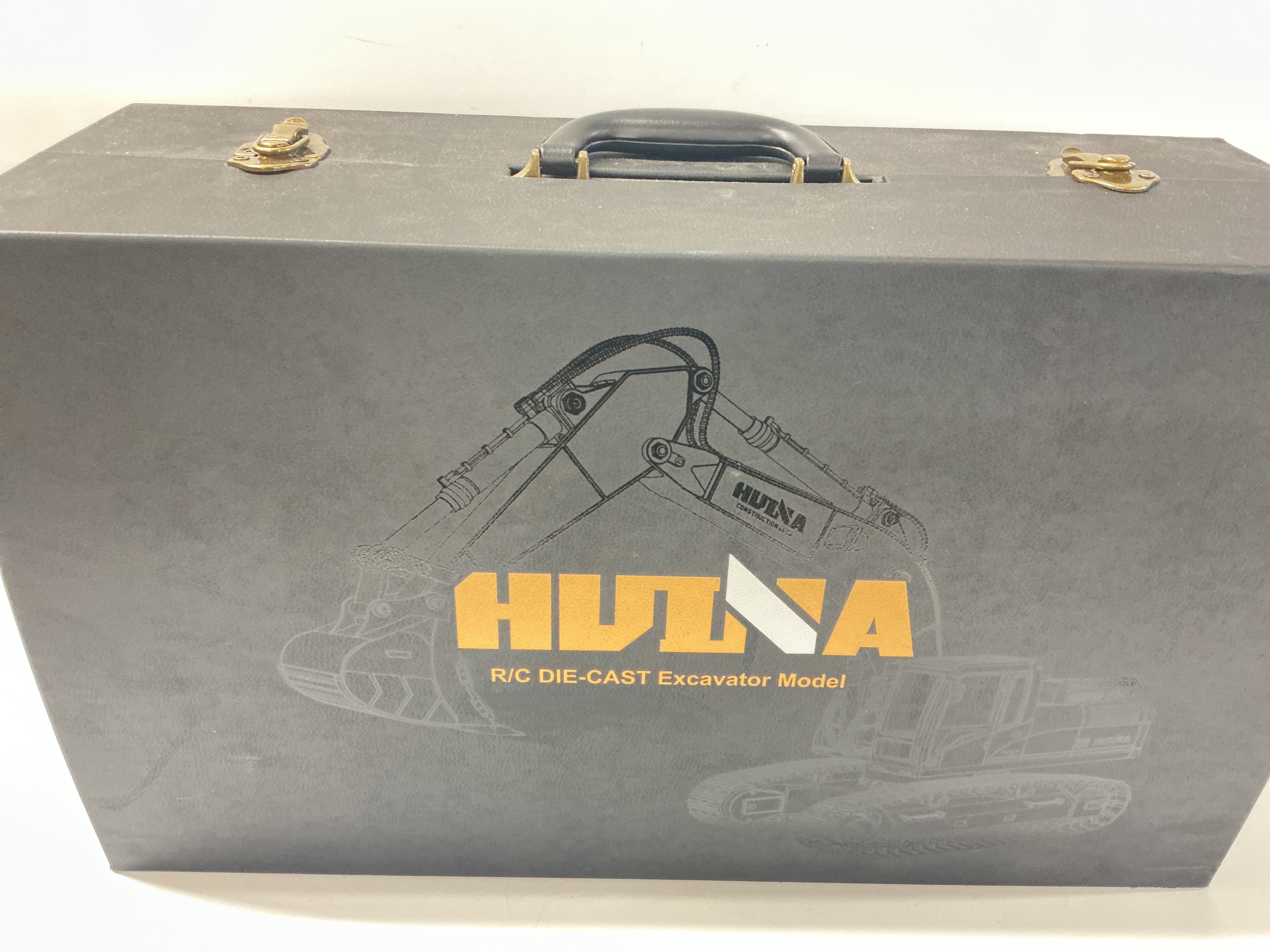 A Boxed HuiNa Remote Controlled Die-Cast Excavator  Odell In Storage Case. No Reserve.