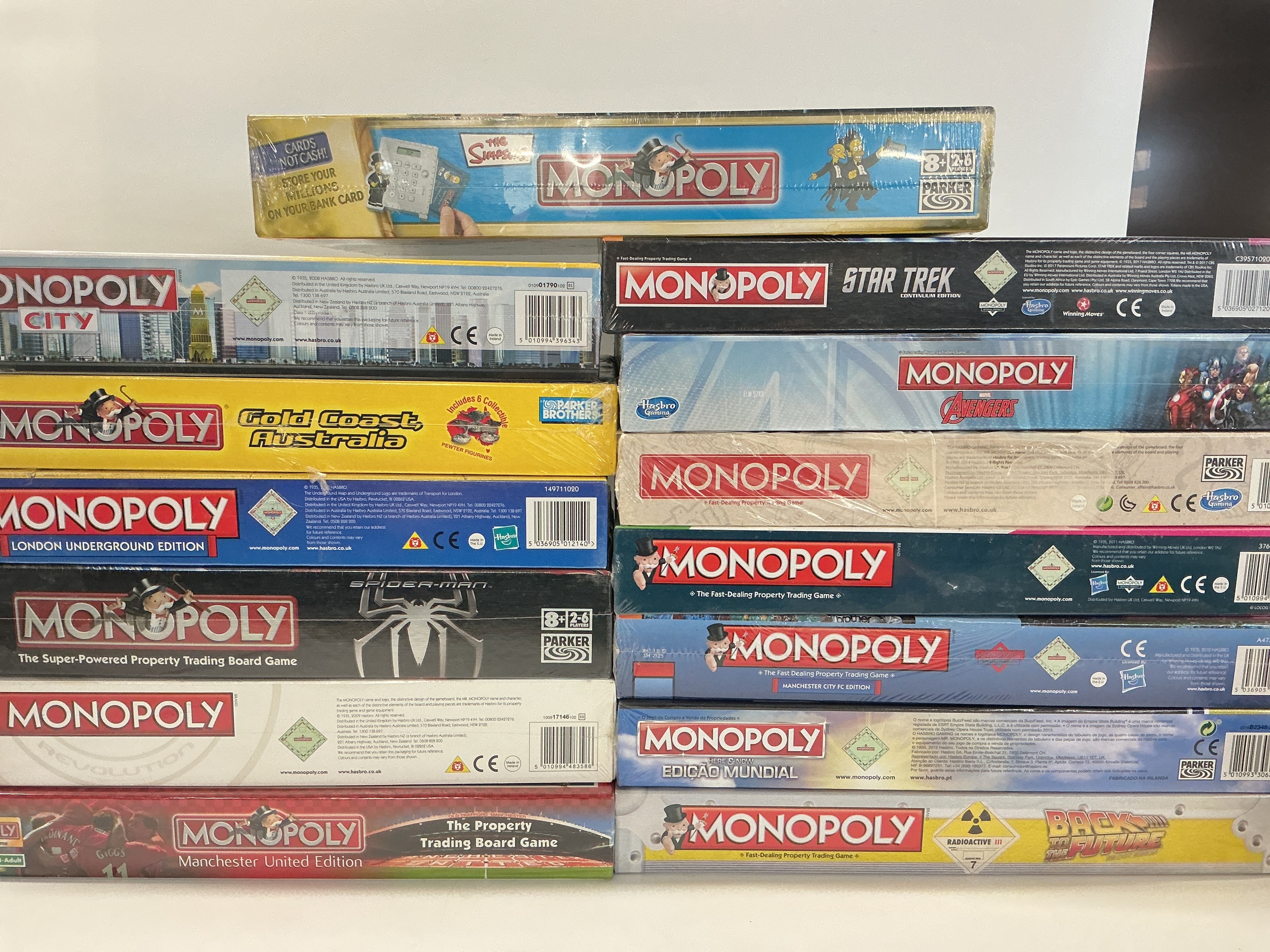 14 Boxed And Sealed Monopoly Board Games, including Back To The Future, Spider-Man, Star Trek Etc. No Reserve.