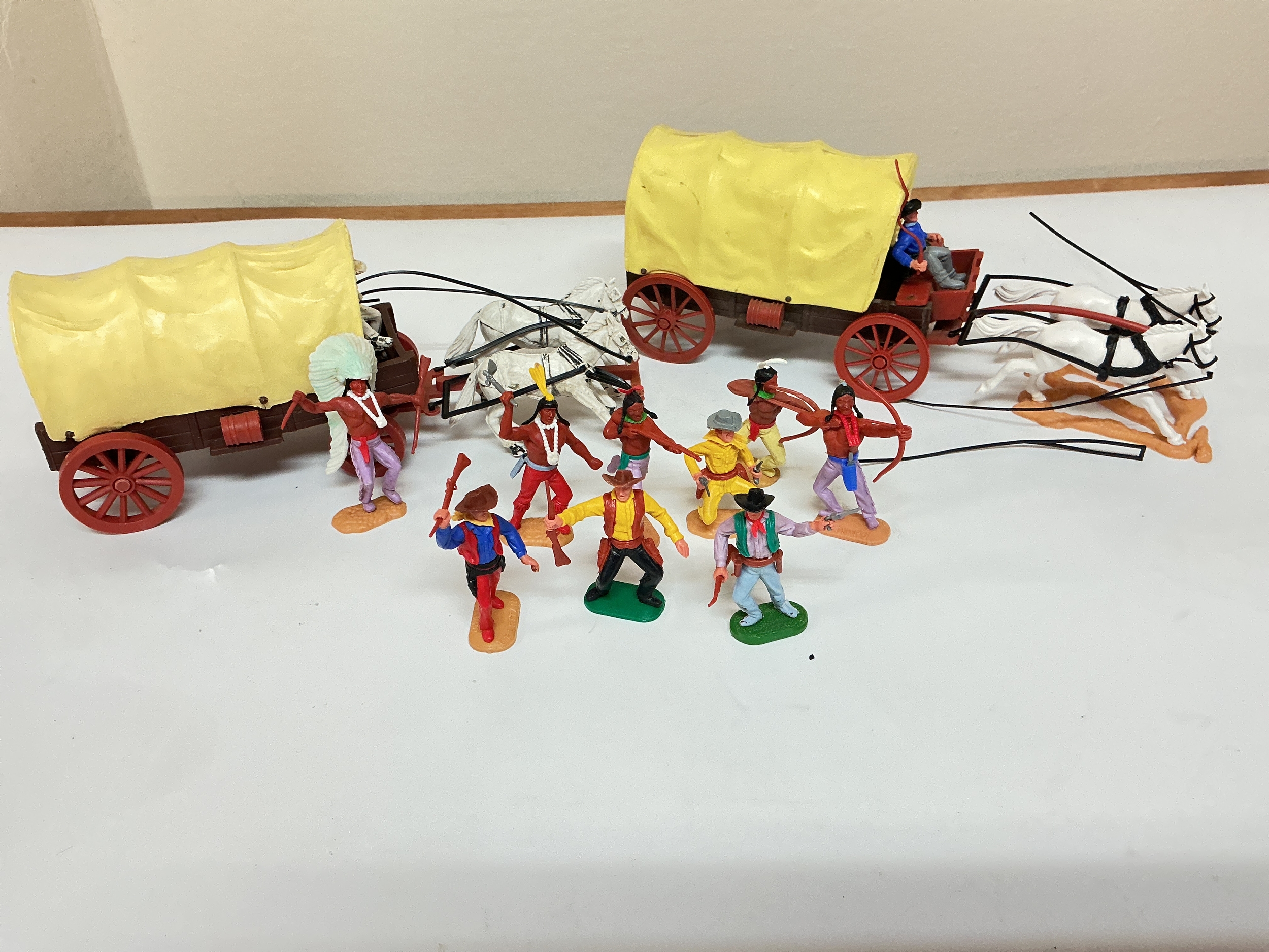 A Timpo 1st And 2nd Series Cowboy Covered Wagons Plus Qty. Of Cowboys And Indians.