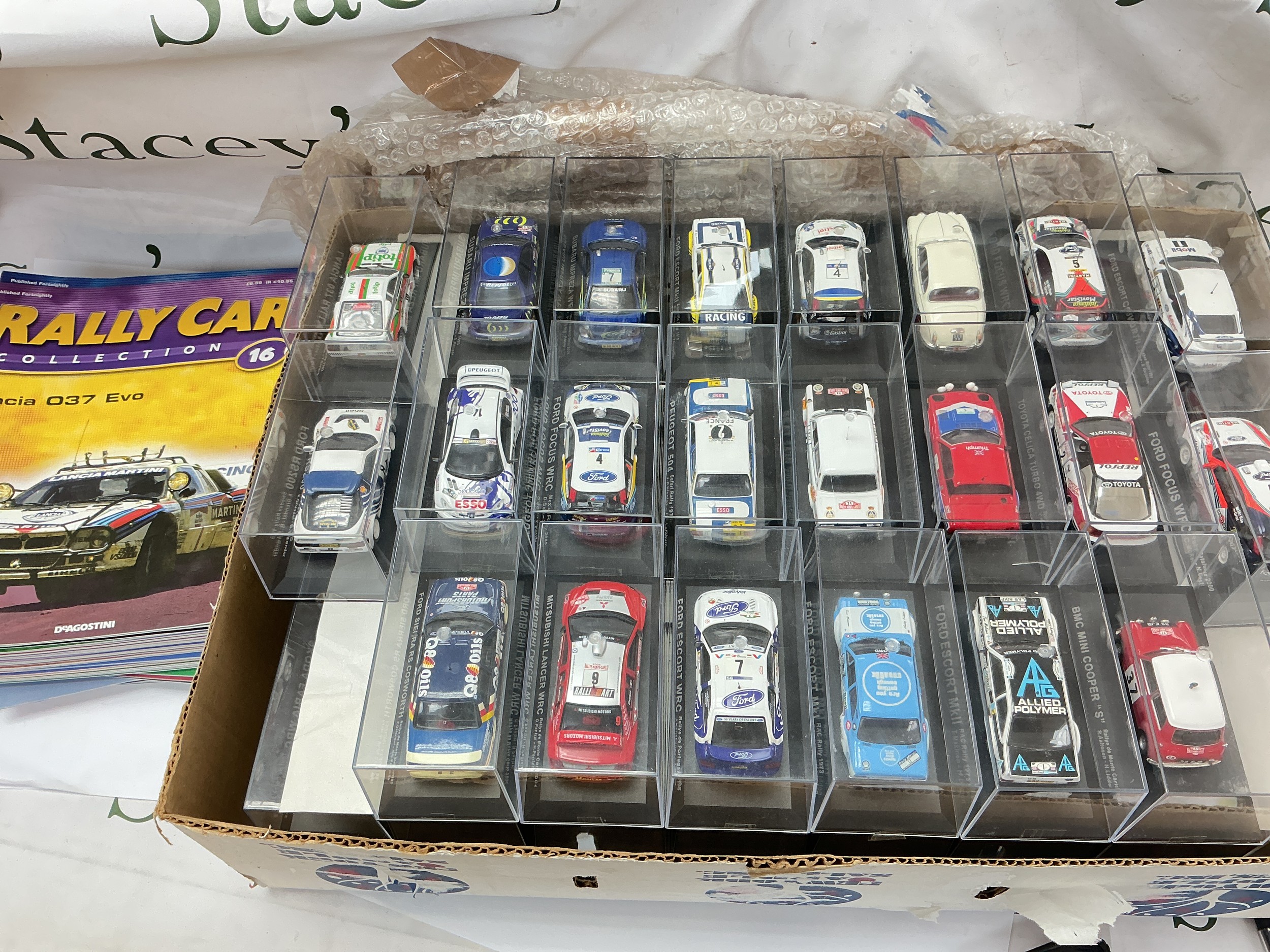 A Collection Of The DeAgostini Rally Car Collection With Binder And Magazines. Approximately 72, No Reserve.