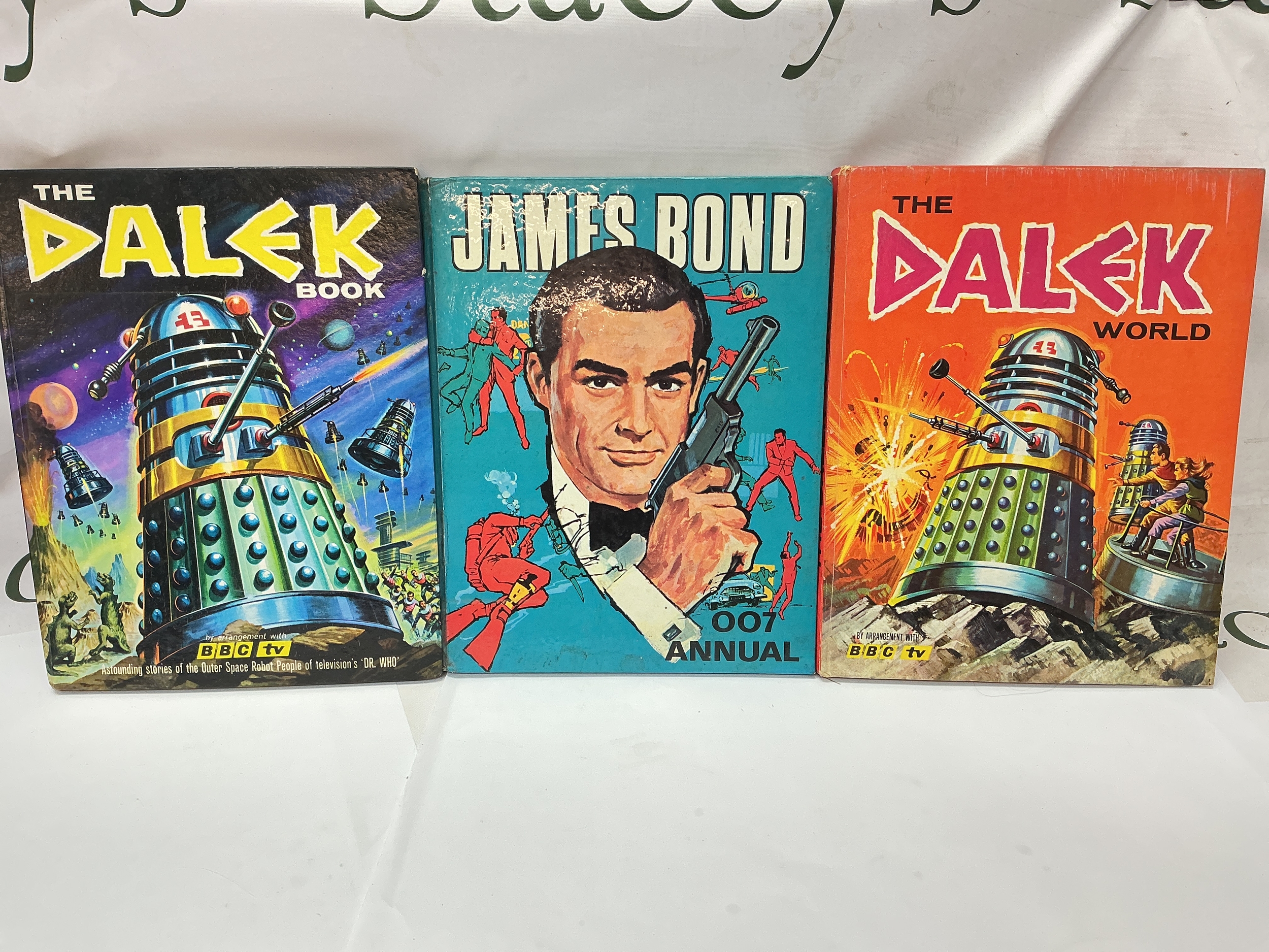 2 Early Doctor Who Dalek Annuals And A James Bond Annual.