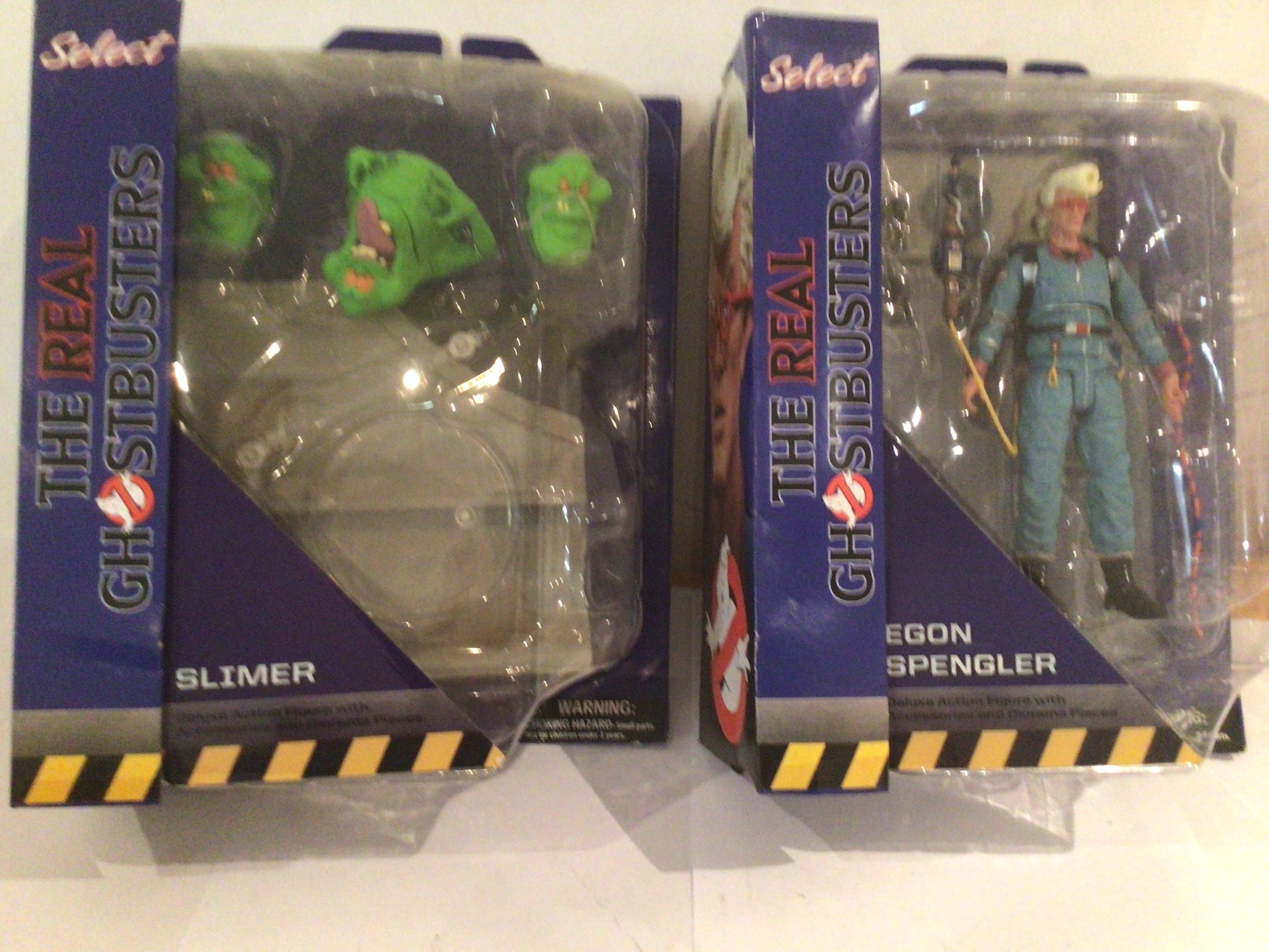 Two boxed and unopened figures featuring Ghostbusters Select 2018, Egon Spengler and Slimer. No reserve.