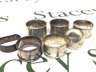 A collection of silver napkin rings mixed dates and designs weight 130g approximately.