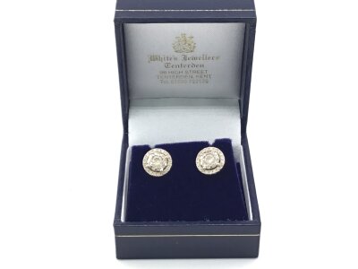 A Pair of 18carat gold earrings set with circular pattern of brilliant cut diamonds weight 3g