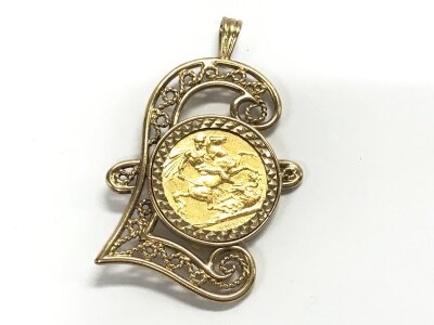 An 1889 full sovereign mounted in a money pendant. Approx 14.92 grams.
