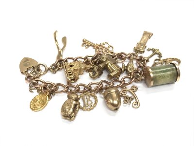 A 9ct gold charm bracelet. Approx weight 39.11 grams.