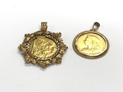 Two half sovereigns in pendant mounts, approx weight 12.75 grams.