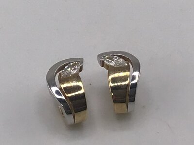 A pair of 9carat gold earrings of modern design white and yellow gold set with CZ  weight 5g