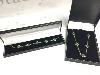 14ct Gold Green clover necklace (7.6g) and a matching bracelet (6.2g).