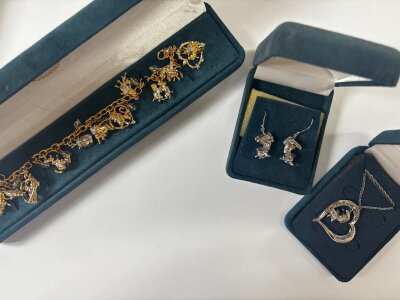 Three boxed Disney Bradford Exchange jewellery items including a pair of earrings, necklace and a bracelet NO. RESERVE
