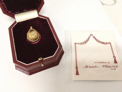 A boxed Limited Edition silver gilt Sarah Fabergé egg pendant, diamond set and with cultured Pearl. Postage category A