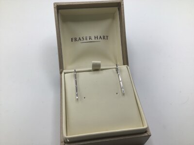 A Pair of 18carat white gold modern design vertical diamond set earrings weight 2.5g