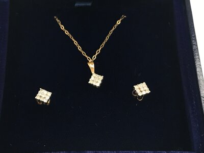 A 9ct gold necklace and diamond earring set pave set with small diamond.
