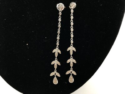A pair of 18ct white gold drop earrings with chip stone diamonds.