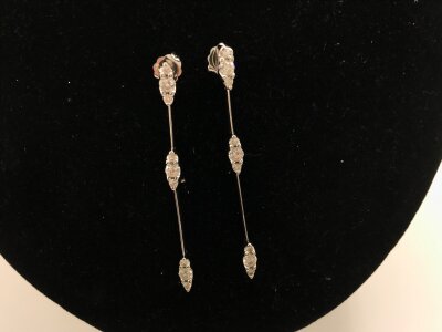 A pair of 18ct gold drop earrings set with diamonds